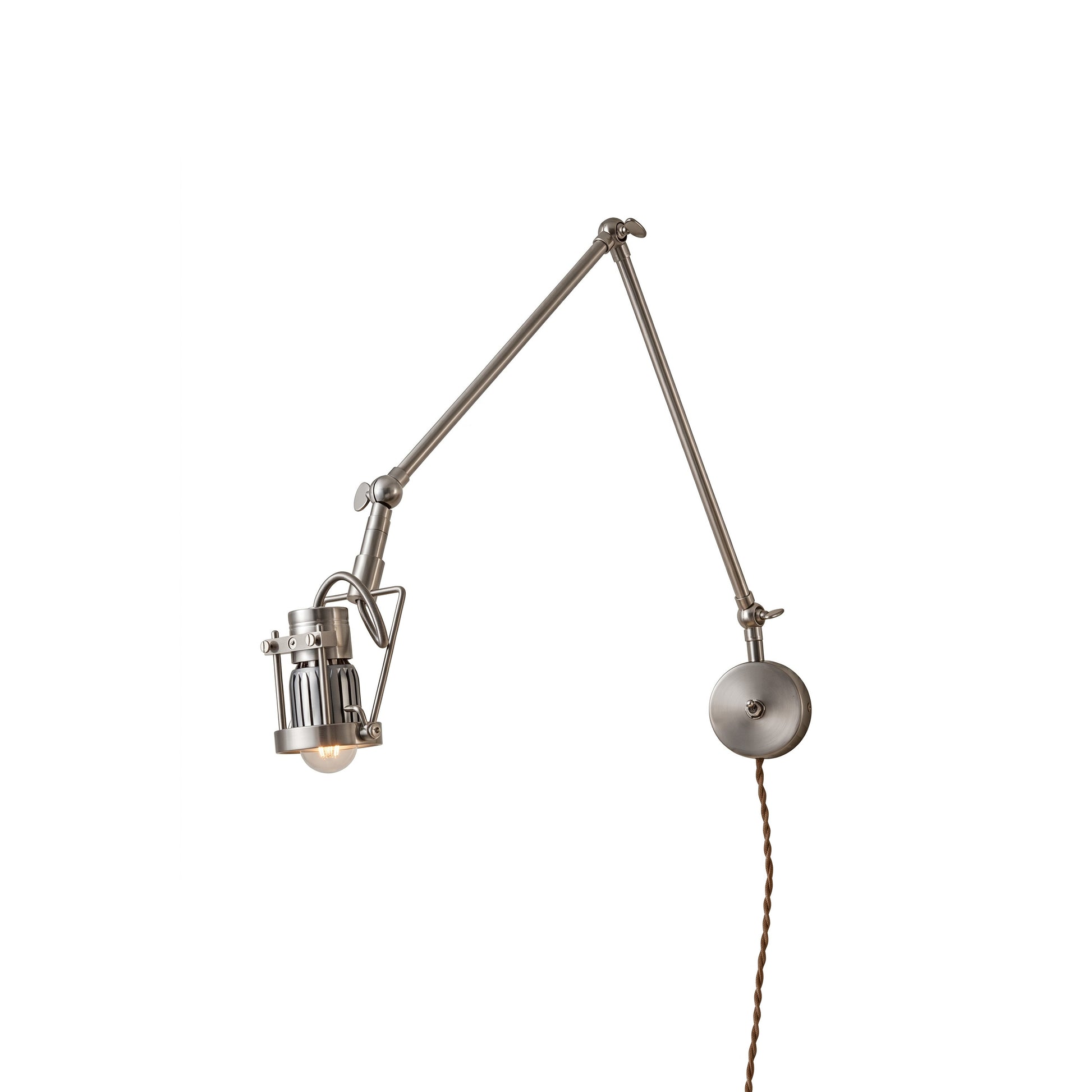Reznor plug-in wall sconce in nickel finish, shown against a neutral wall.
