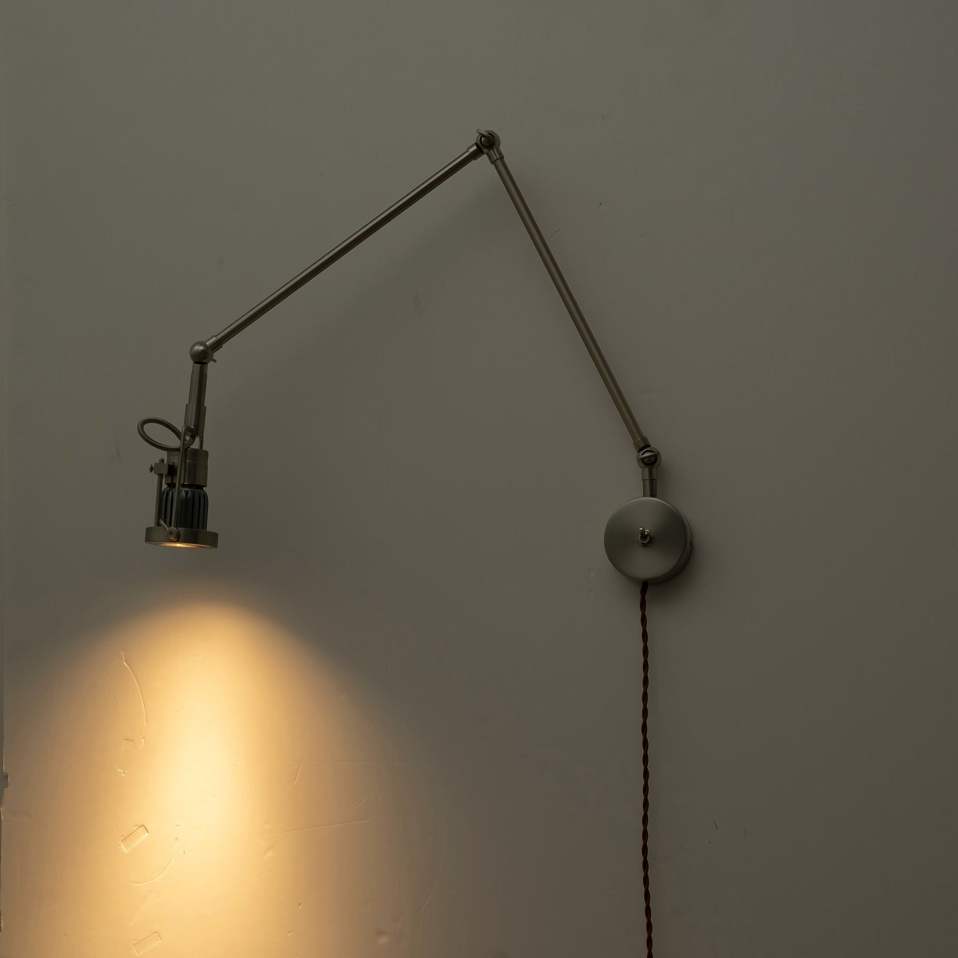 Detail of the wall mounting plate and plug-in cord.