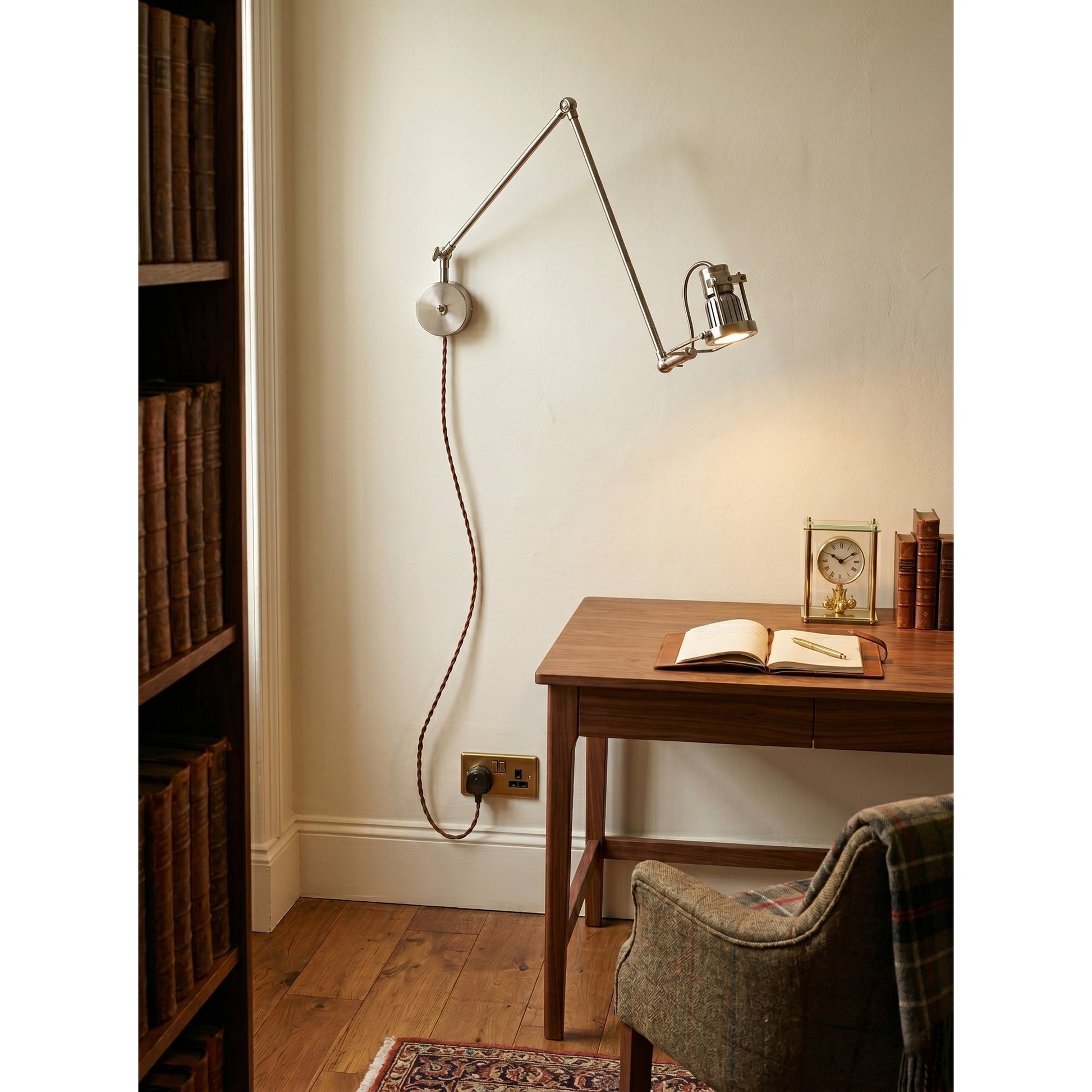 Full view of the sconce, including the twisted fabric plug-in cord.