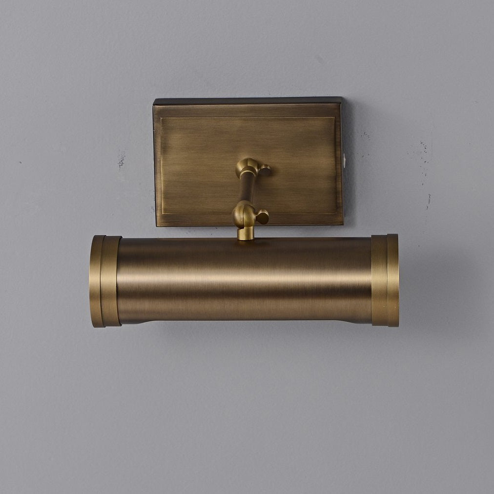 The two light heads of the sconce shown from below.
