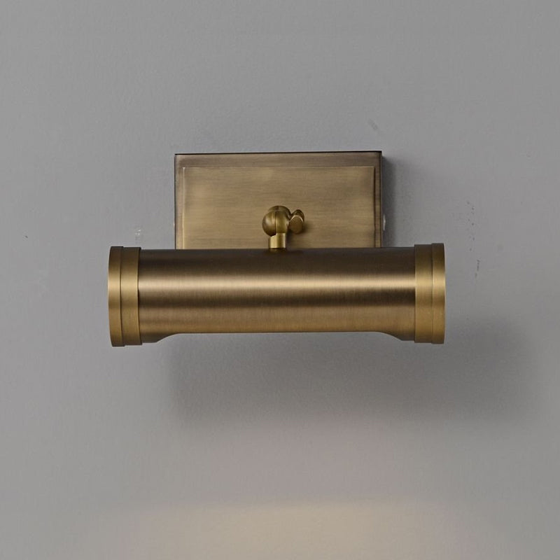 Ridgewood Wall Sconce against a dark, textured wall.
