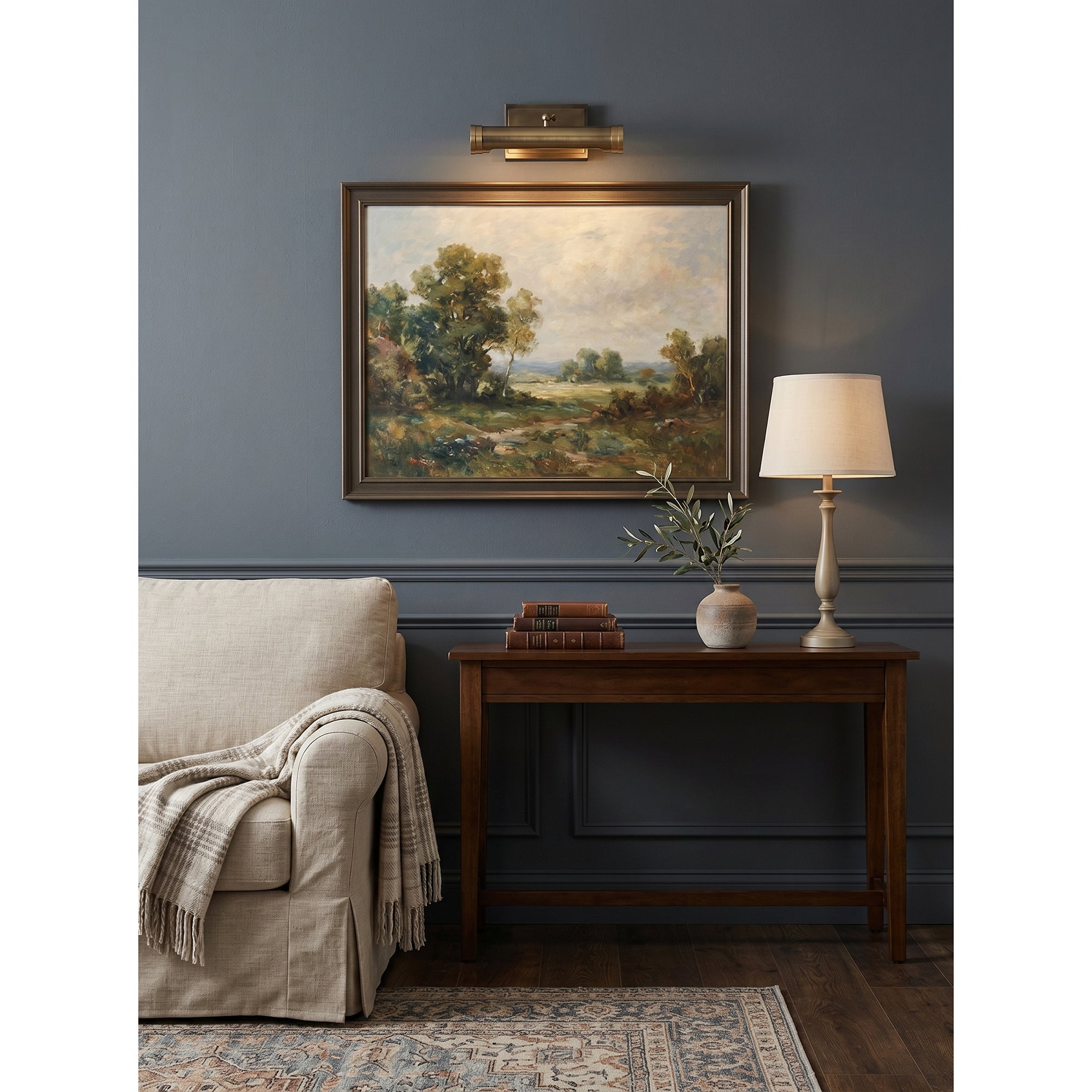 Ridgewood Wall Sconce installed above a painting in a living room.