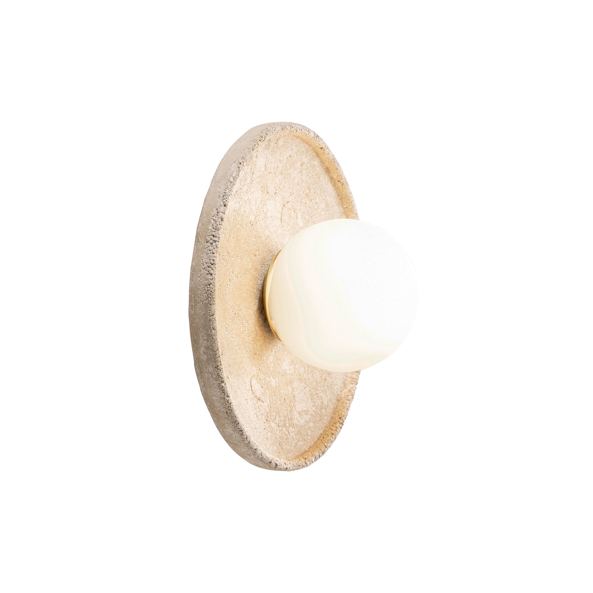 Riley Travertine Wall Sconce shown against a neutral wall.