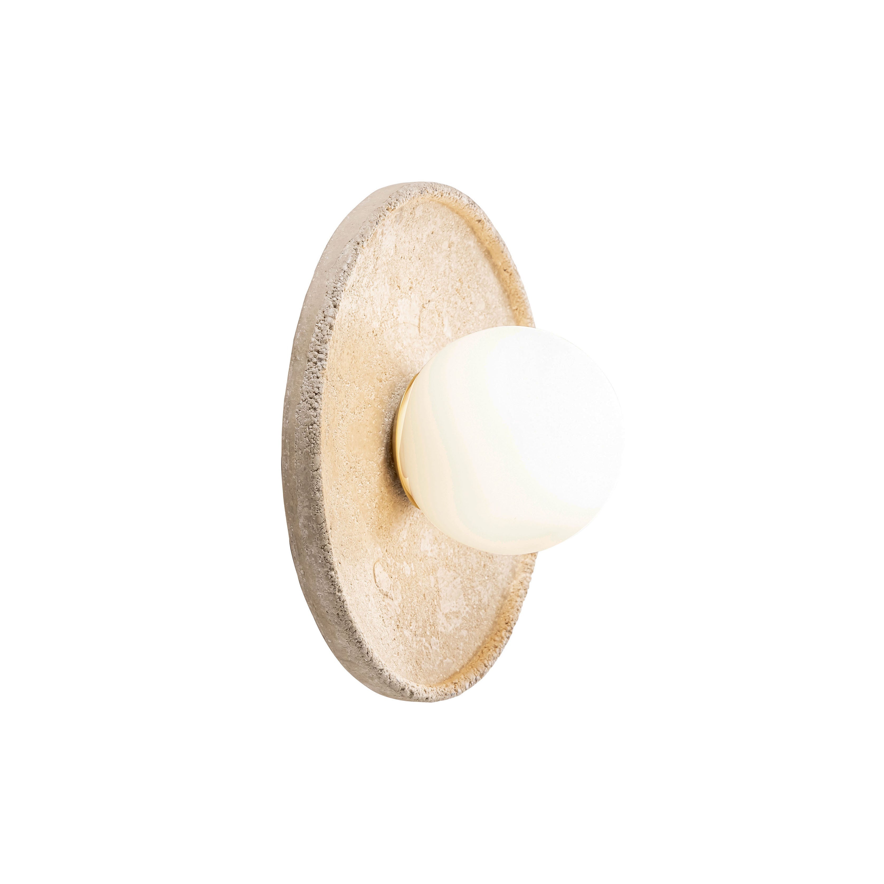 Riley Travertine Wall Sconce shown against a neutral wall.