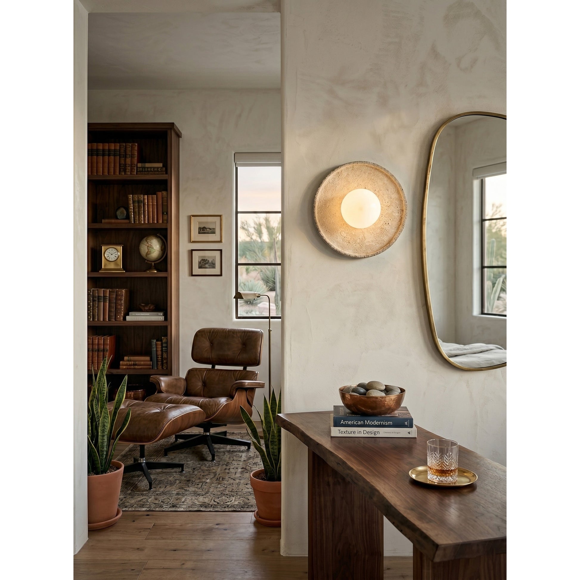 Unlit Riley Travertine Wall Sconce showcasing its sculptural form.