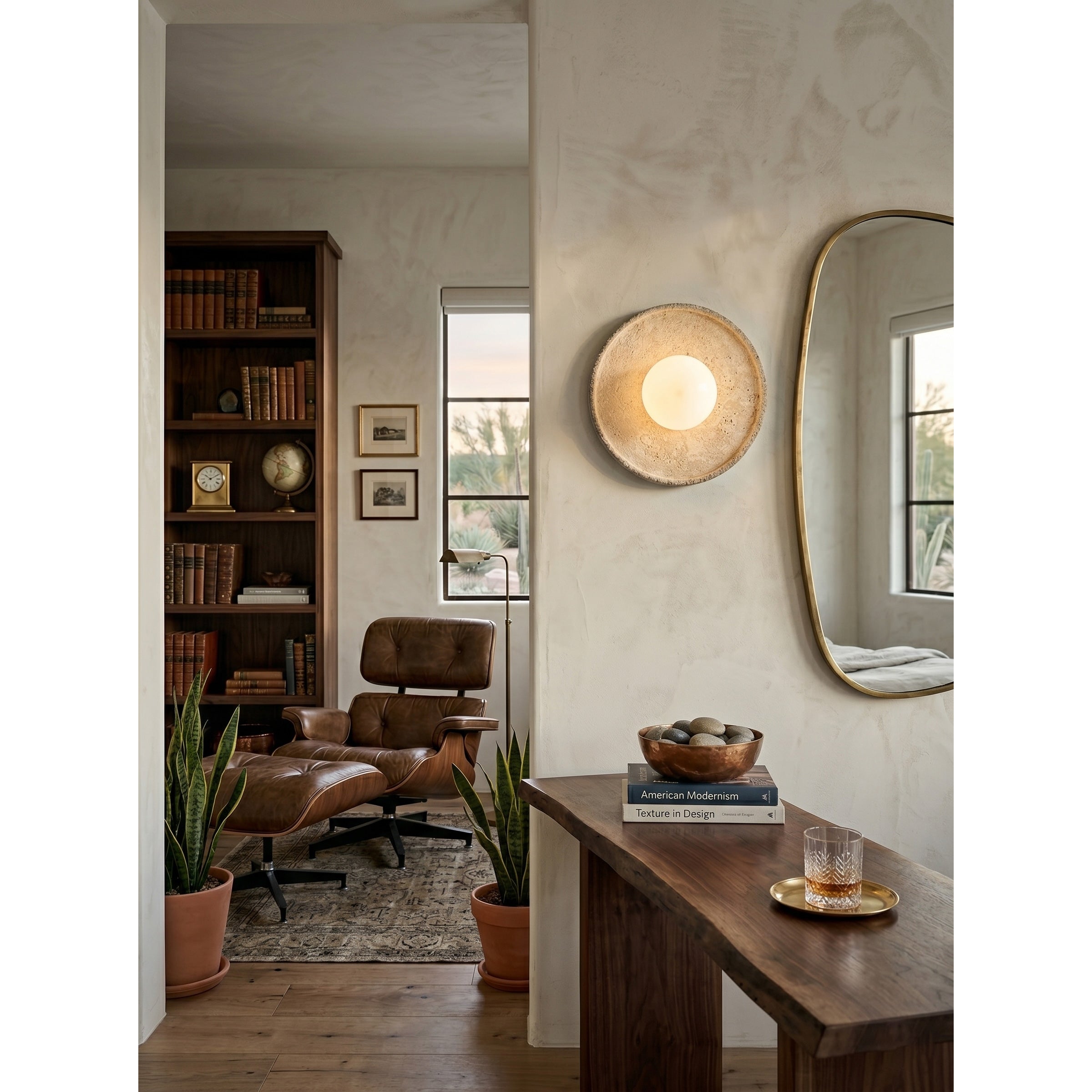 Unlit Riley Travertine Wall Sconce showcasing its sculptural form.