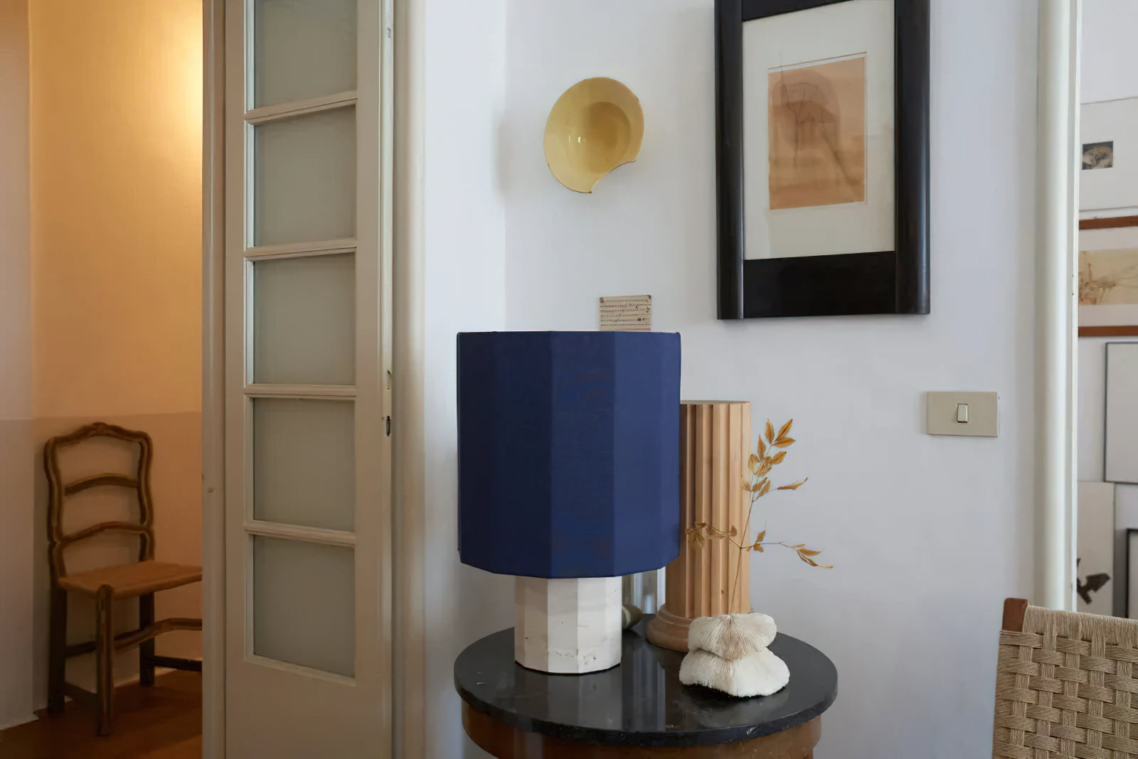 Roma Dodecagon lamp styled on an upscale bedroom nightstand.