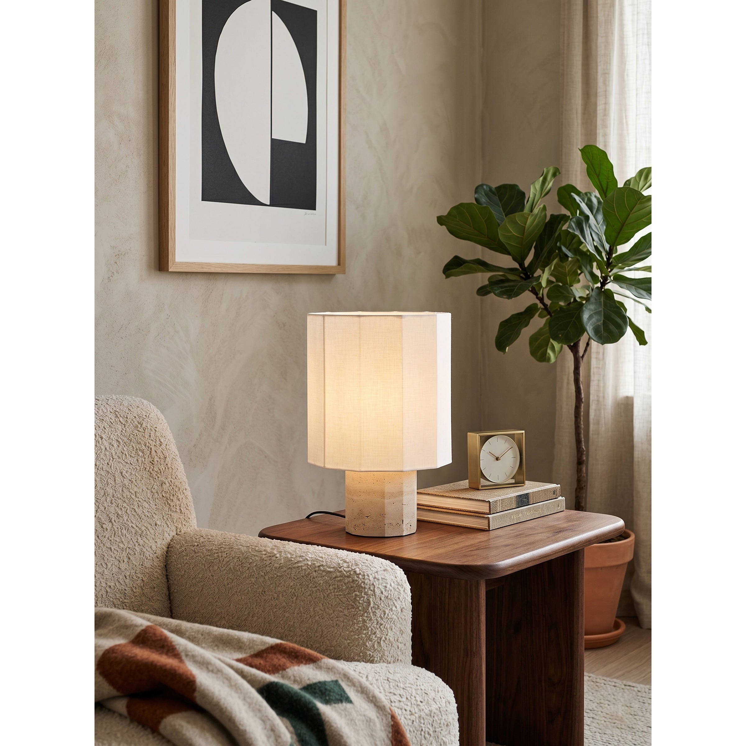 Architectural profile of the travertine table lamp against a plain background.