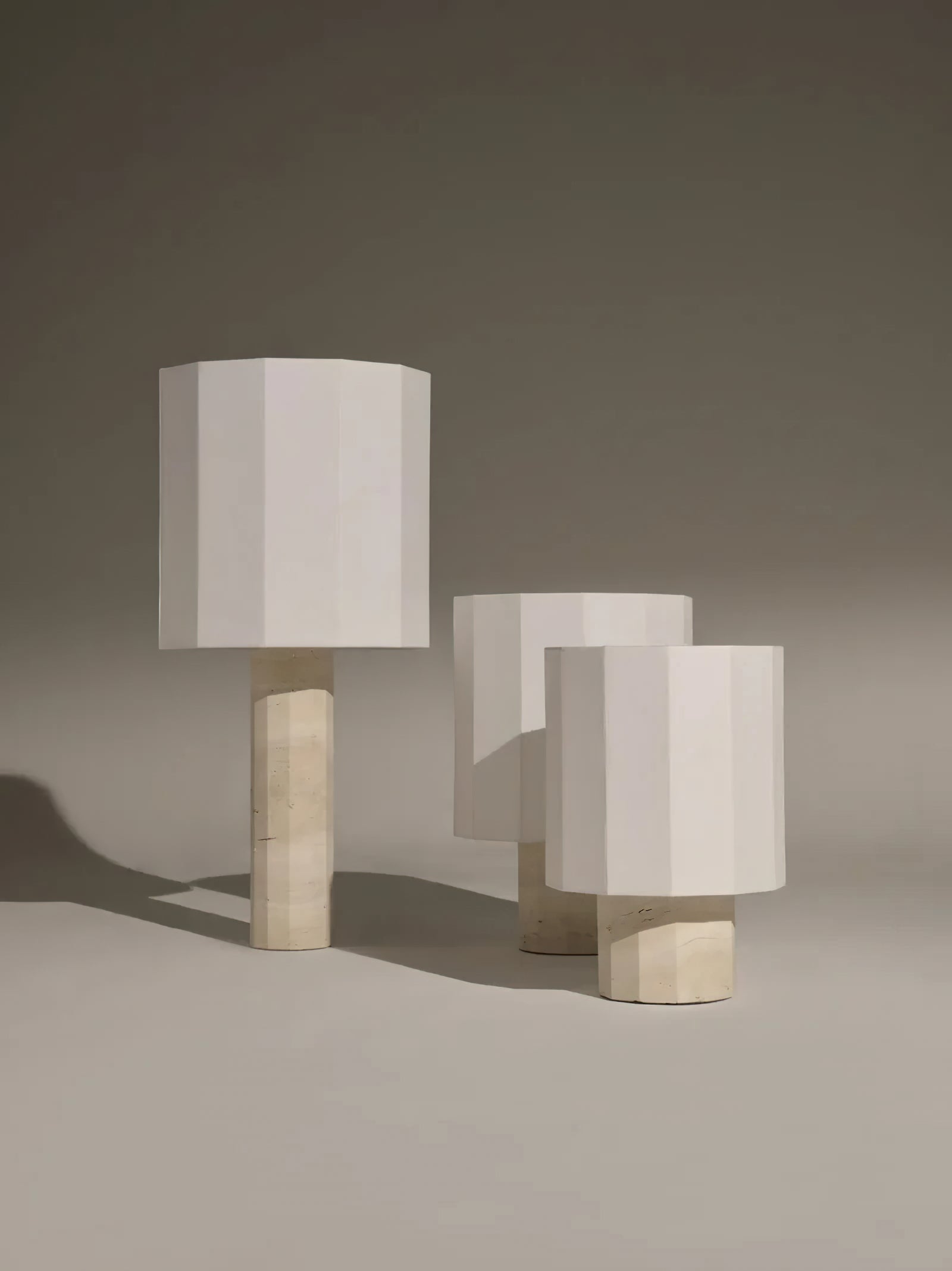 Roma Dodecagon lamp with a red fabric shade.