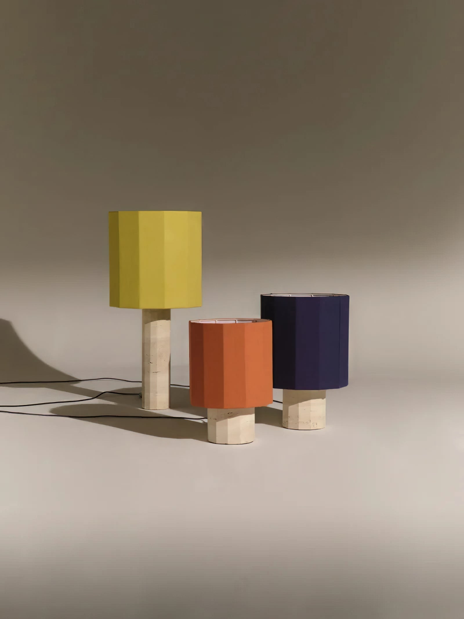 Roma Dodecagon lamp with a white fabric shade.