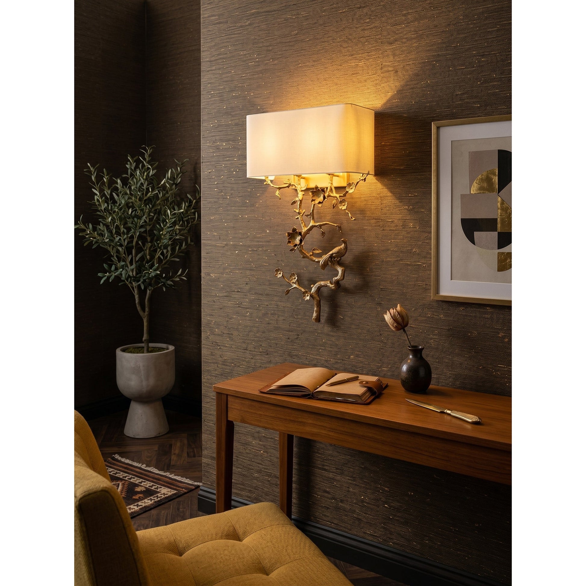 The Sanremo Wall Sconce illuminated, casting a warm glow.