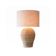 Saona Rattan Table Lamp with a natural finish and white shade.