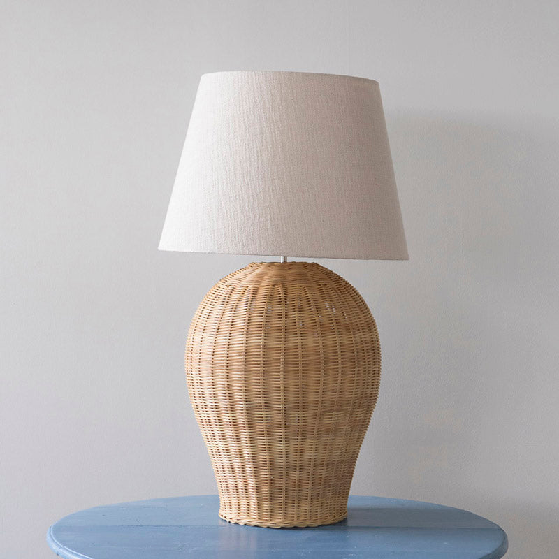 The Saona Rattan Table Lamp against a plain white background.