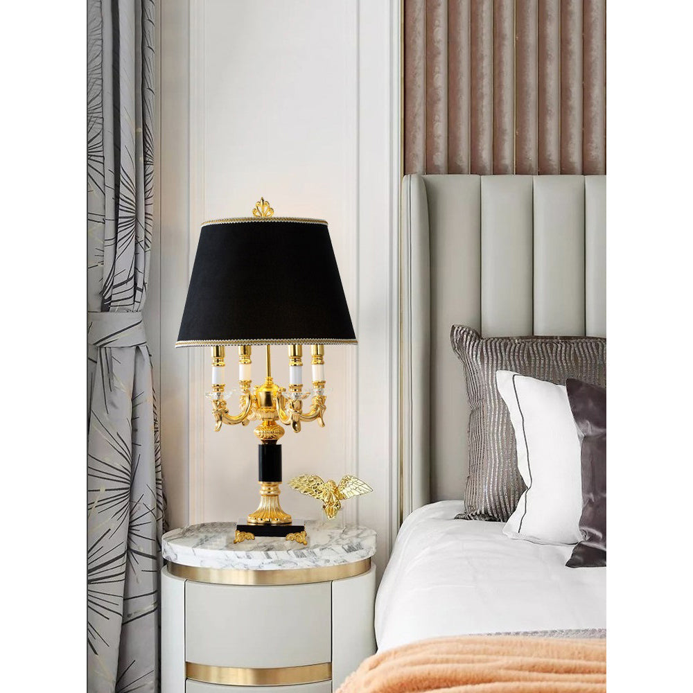Lifestyle image of the Sens Table Lamp in a classic library setting.