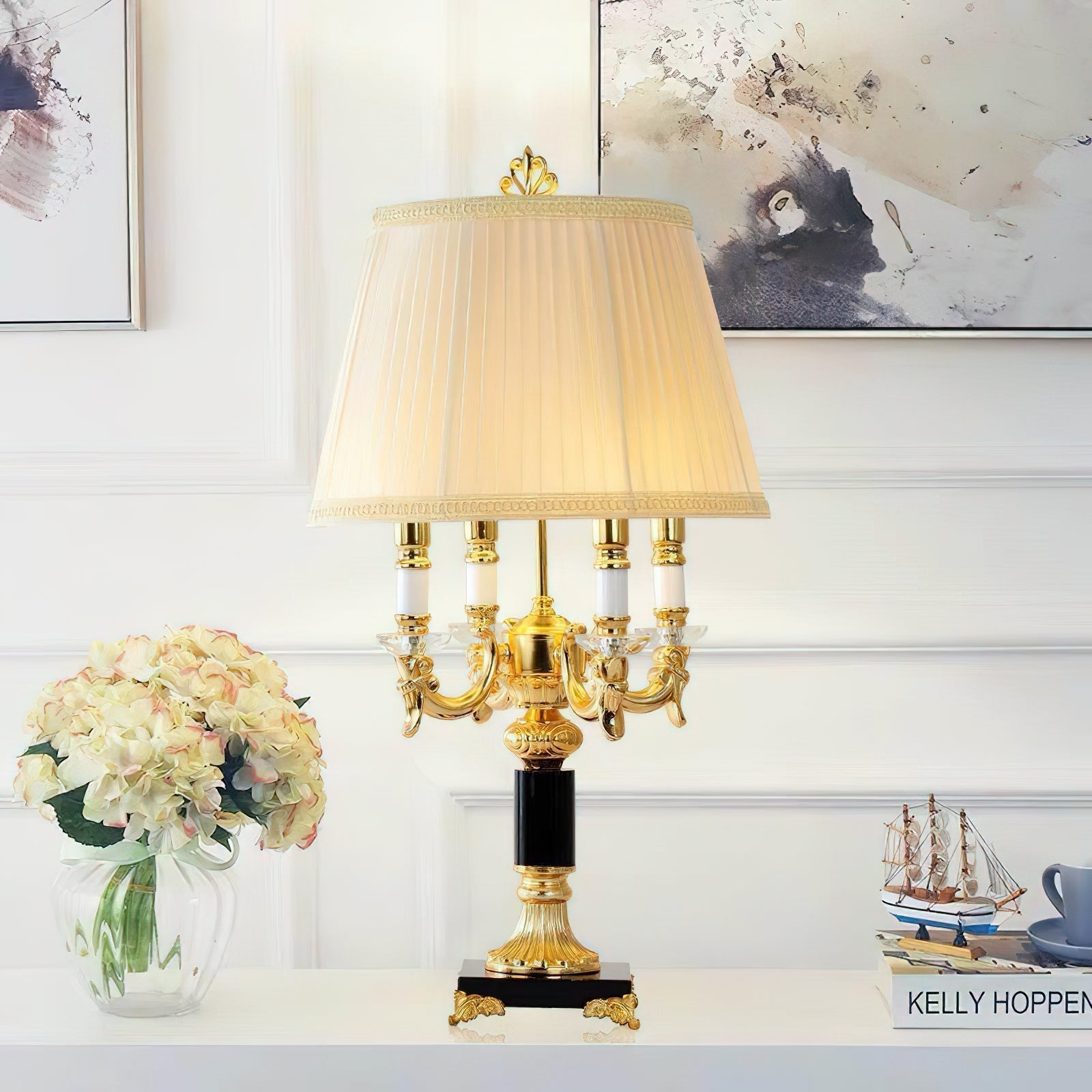 Detail shot of the black fabric drum shade with elegant gold trim.