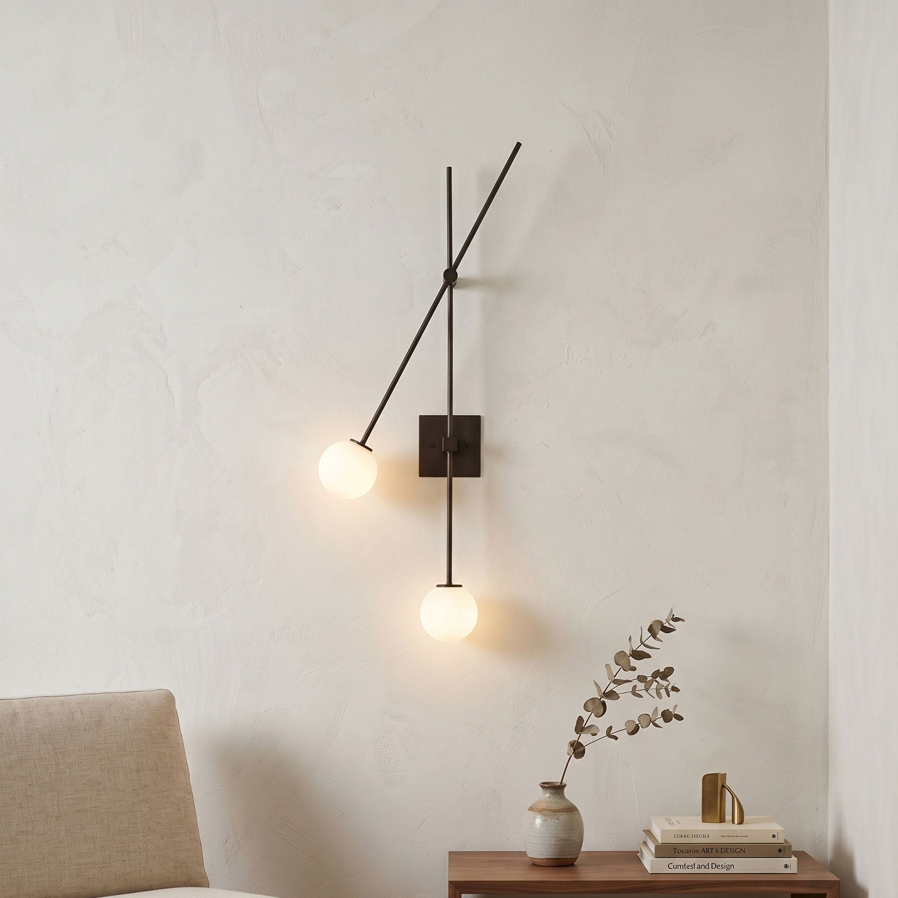 Angled view of the gold Tempo Wall Sconce showcasing its asymmetrical design.
