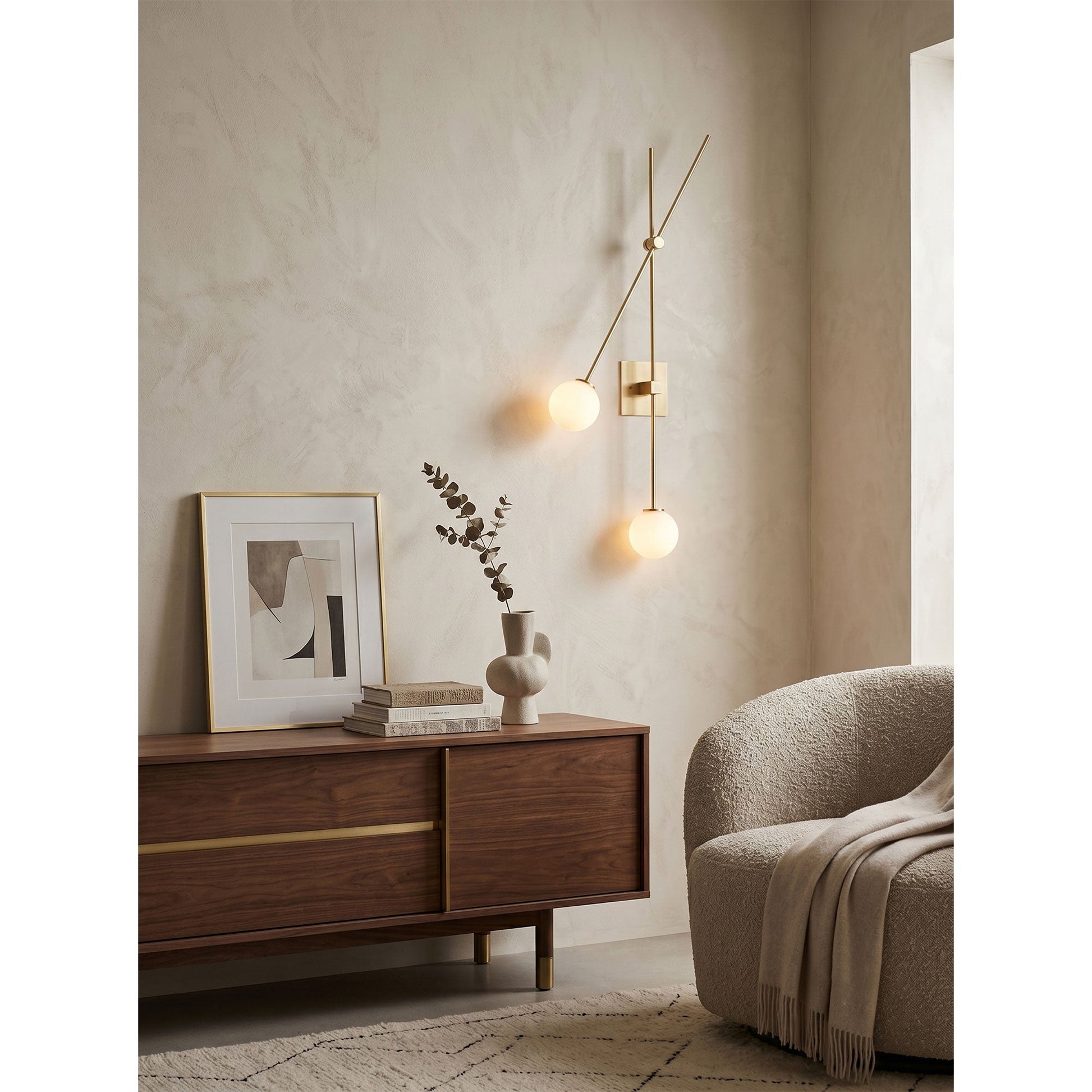 Close-up of the white glass globe and metal arm on the black sconce.