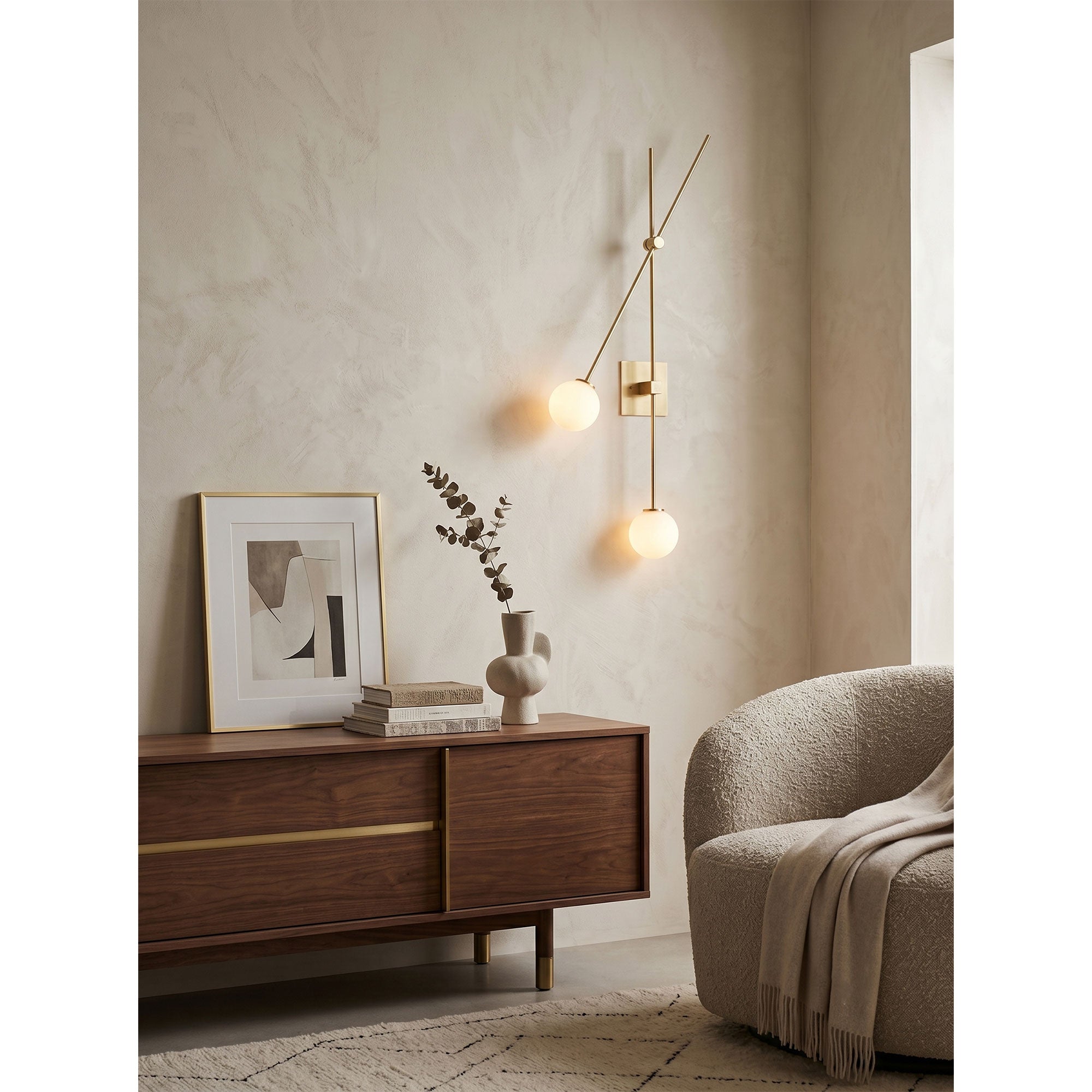 Close-up of the white glass globe and metal arm on the black sconce.