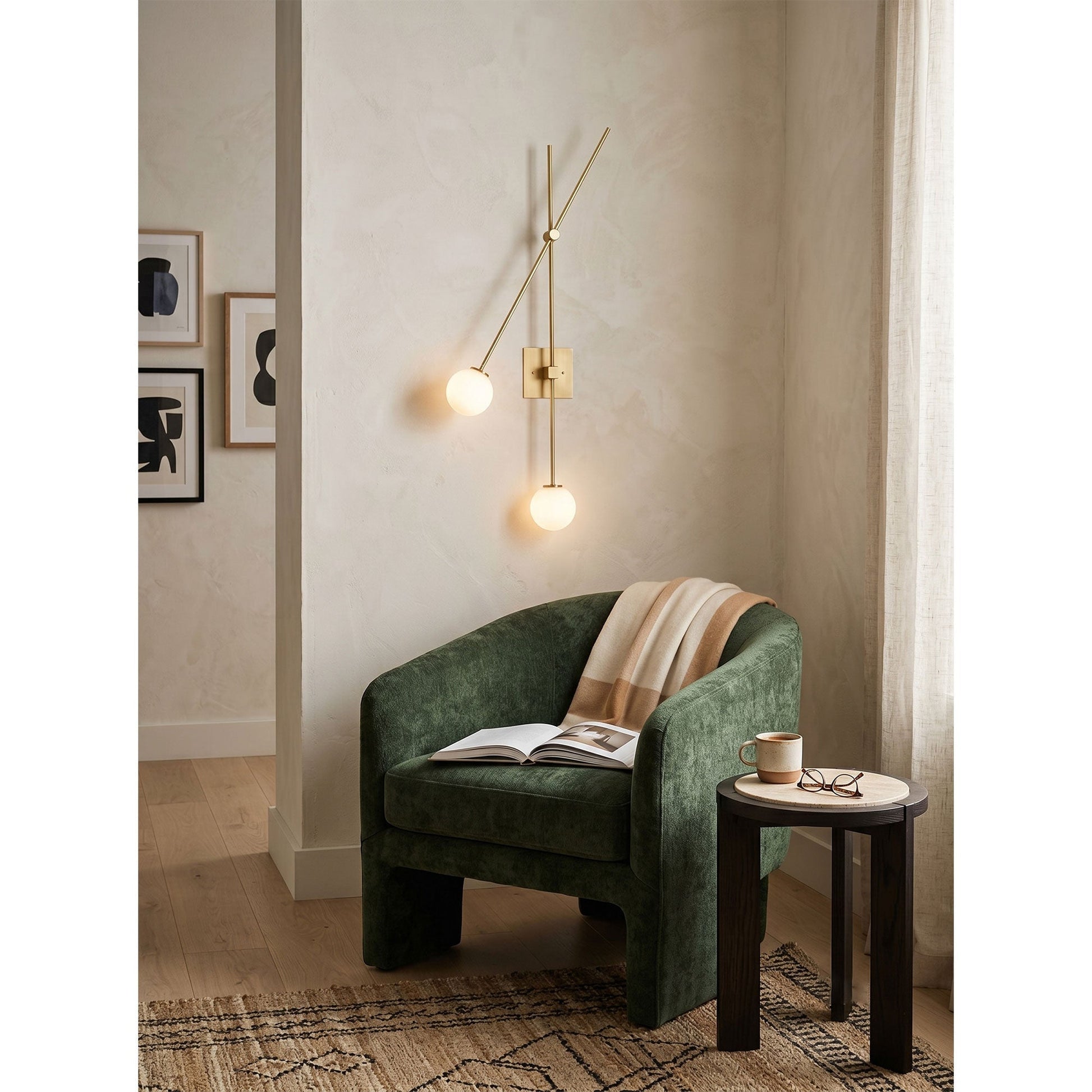 The sconce shown illuminated, casting a warm and diffused glow.