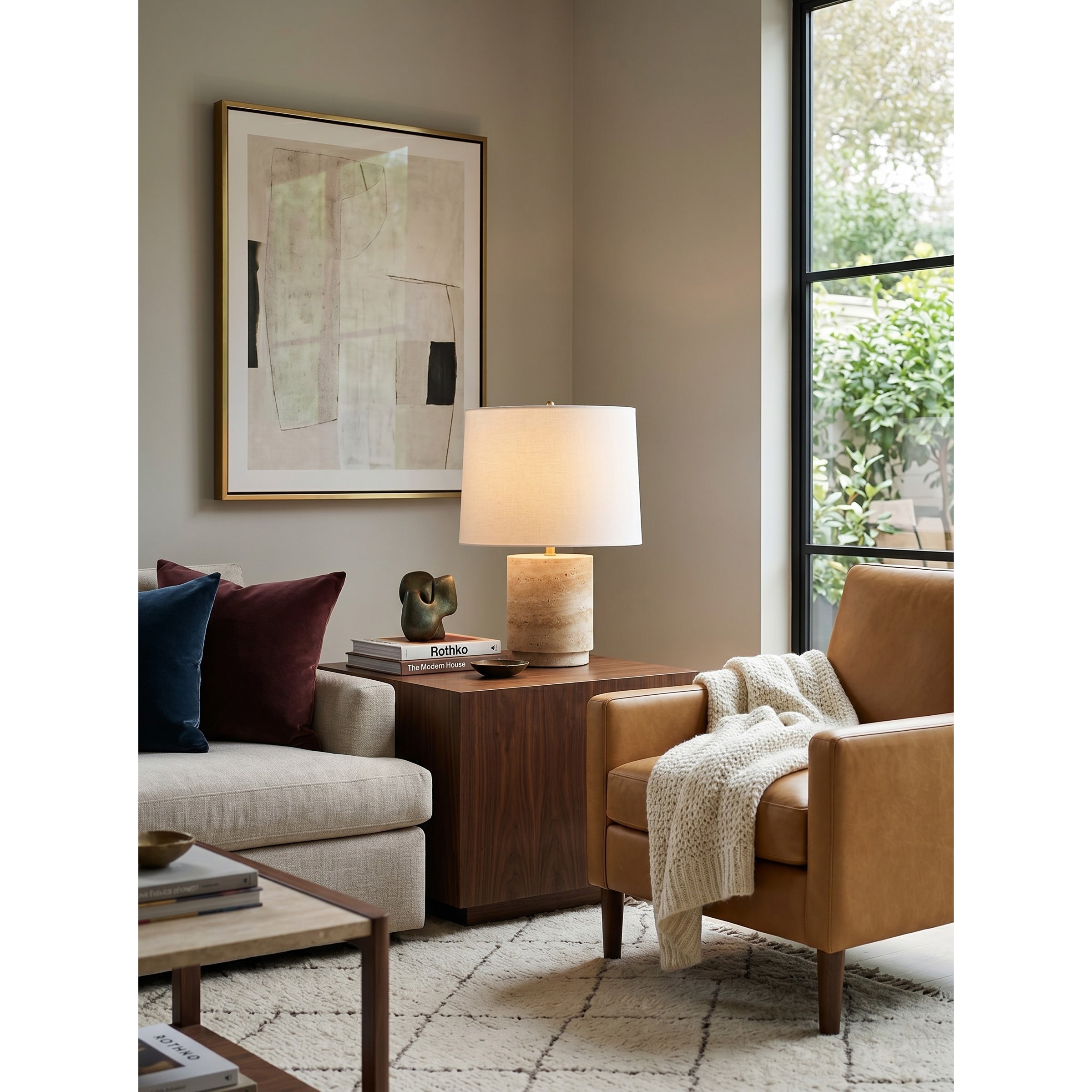 Detail shot of the subtle metal hardware accents on the travertine lamp.