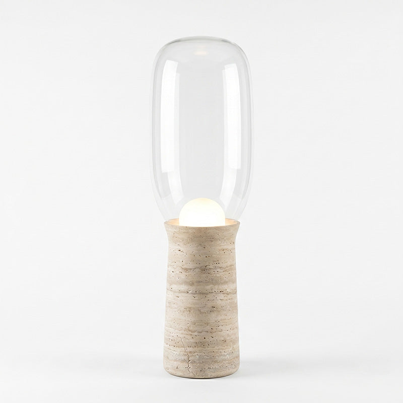 The Torch Floor Lamp providing a cozy atmosphere in a bedroom.
