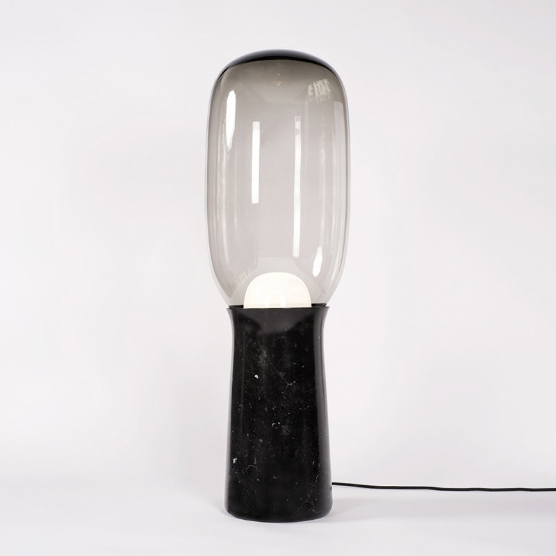 The Torch Floor Lamp shown in a product studio setting.