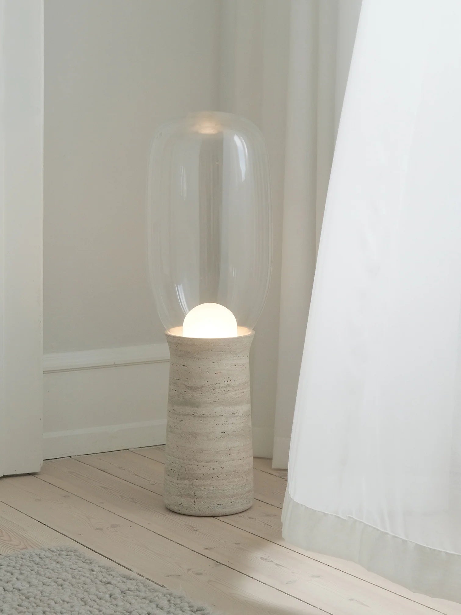 Detail shot of the oversized capsule glass dome over the frosted orb.