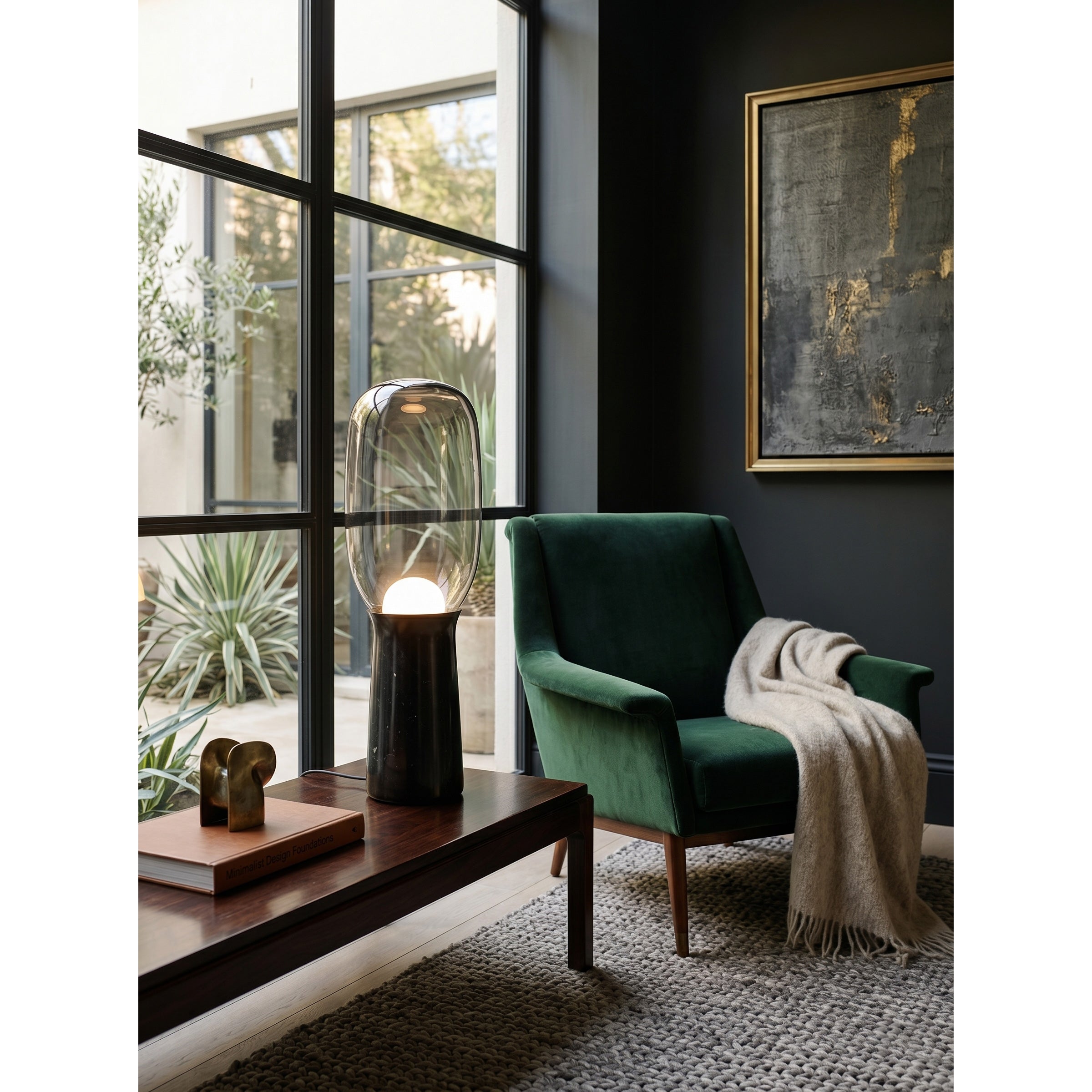 The Torch Floor Lamp illuminating a chic living room corner.