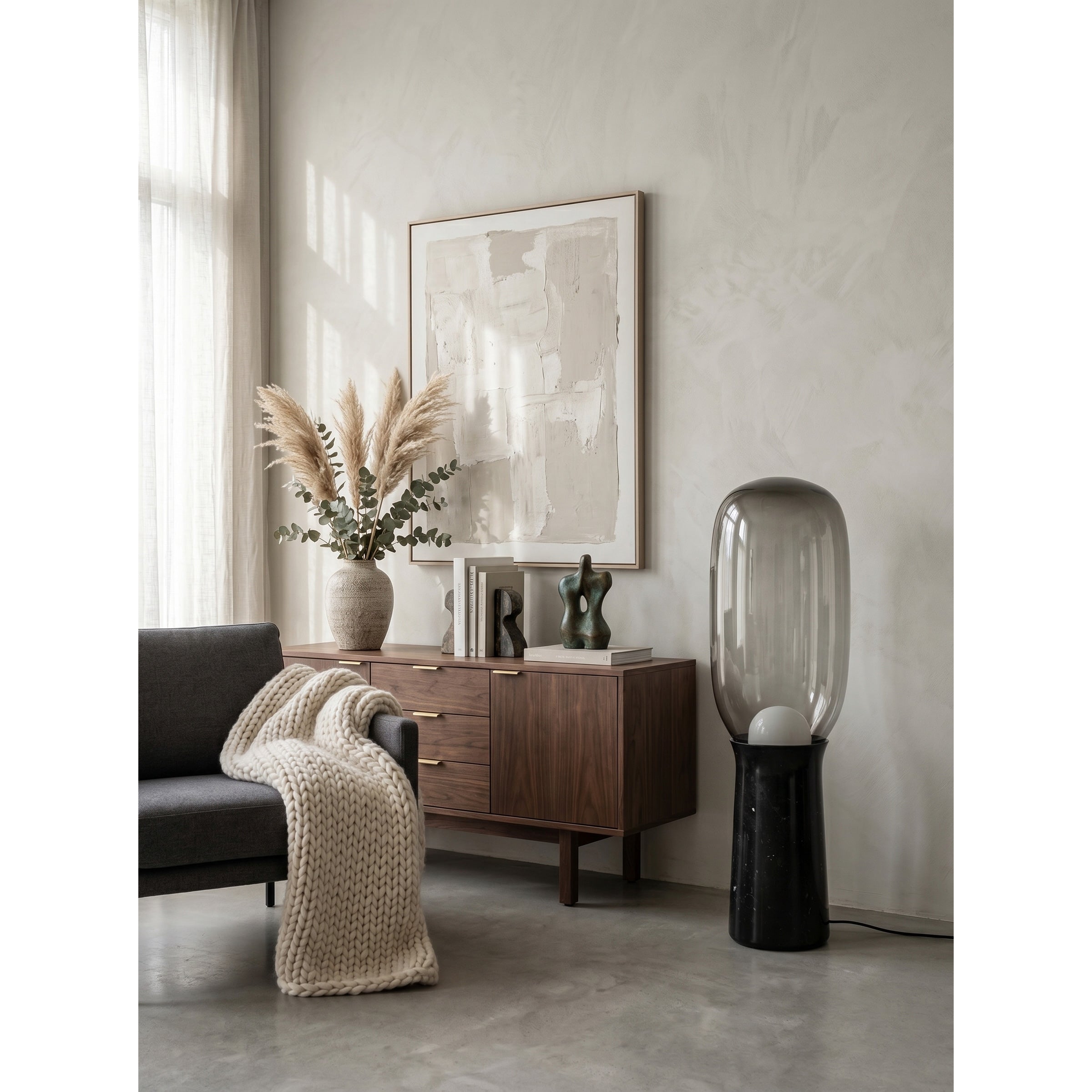 The soft, warm ambient light emitted from the lamp's frosted orb.