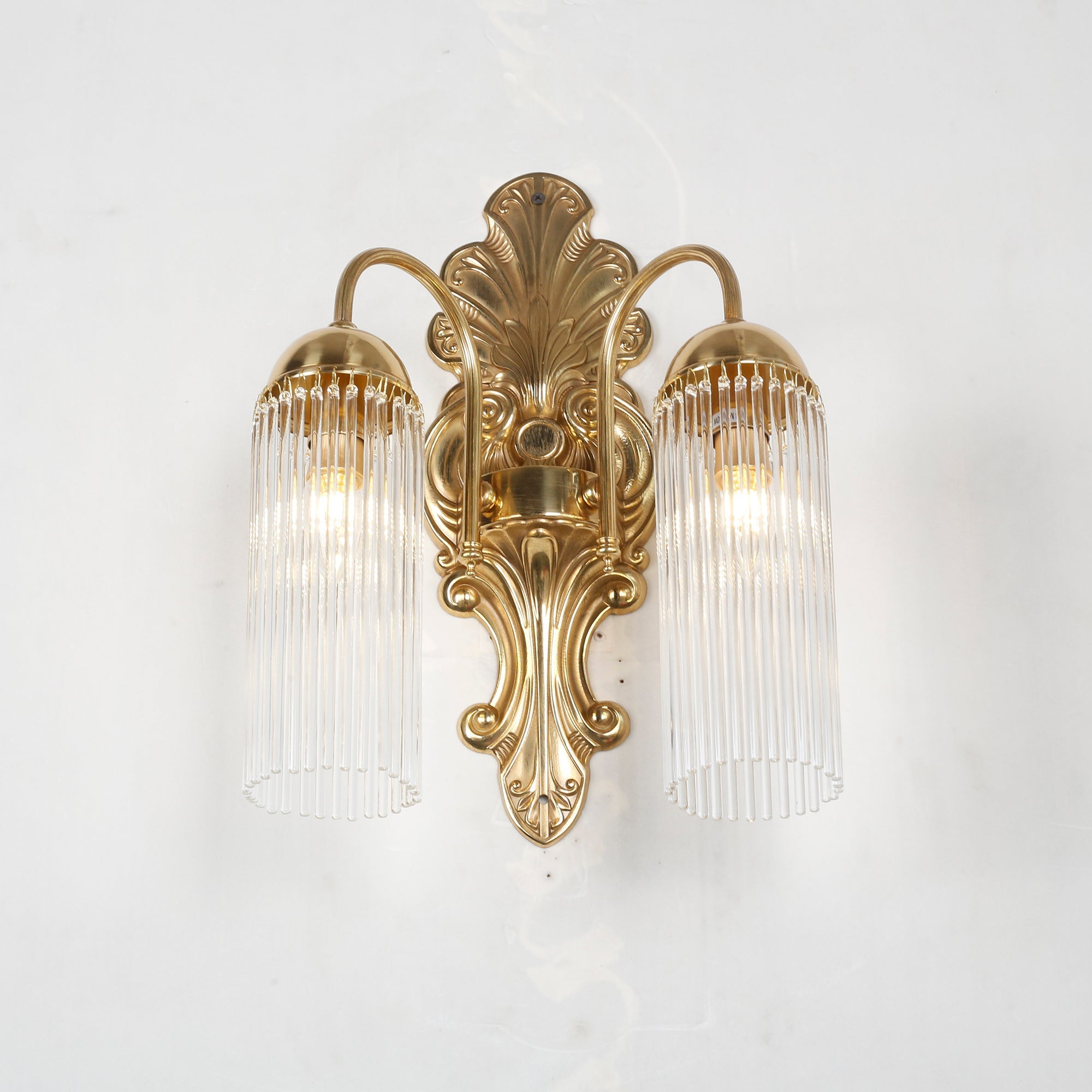 The Triest Wall Sconce against a light wall for contrast.