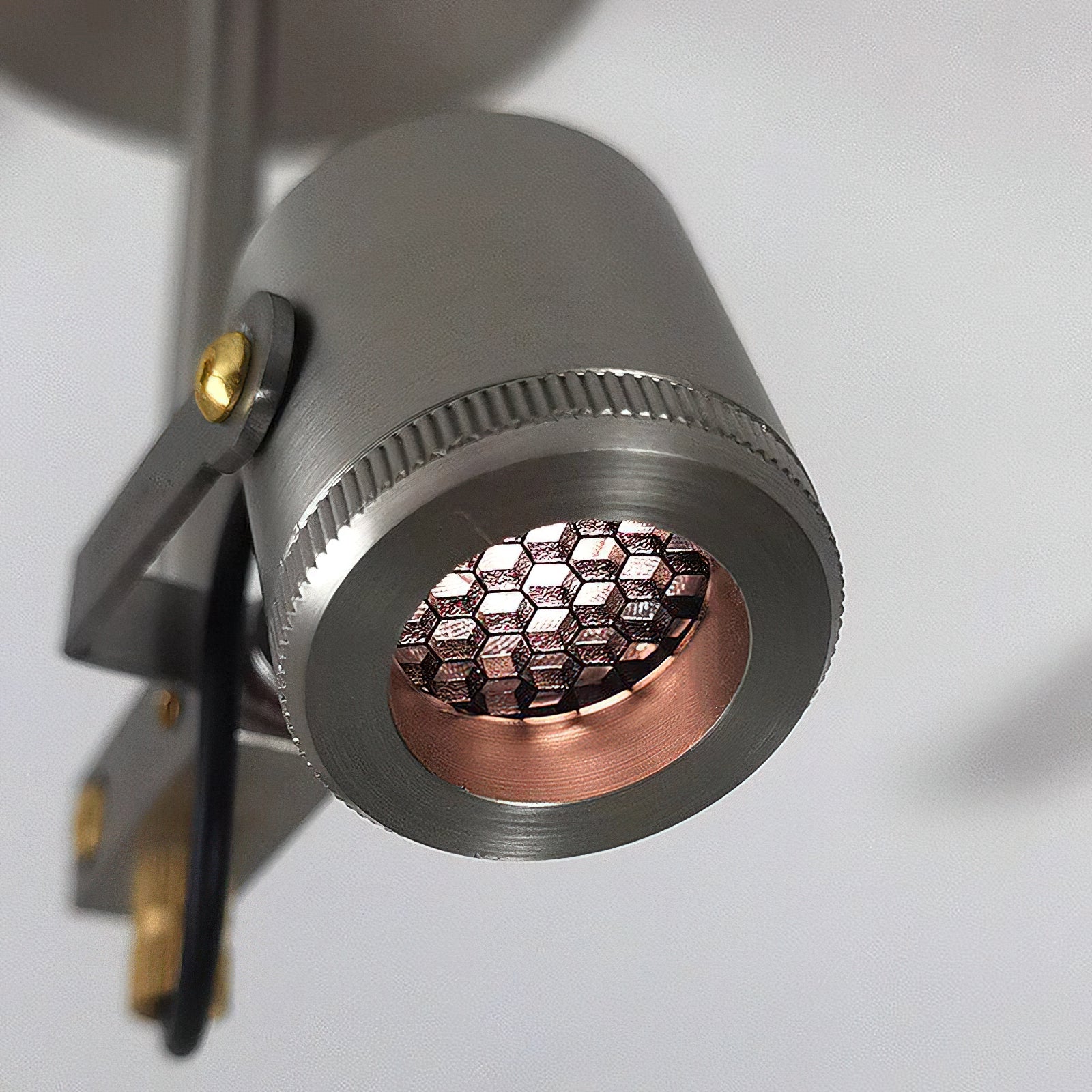 Another angle of the Triton spotlight, emphasizing its sleek aluminum construction.