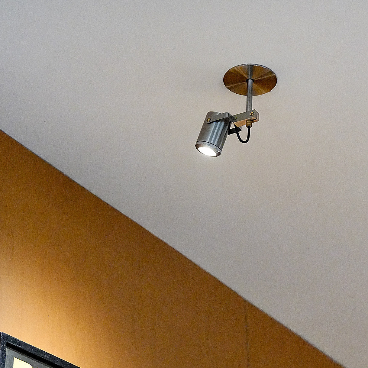 Side profile of the Triton LED Flush Mount showing its sleek dimensions.