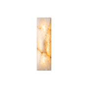 Front view of the Tropez Alabaster Wall Sconce with a gold metal body.