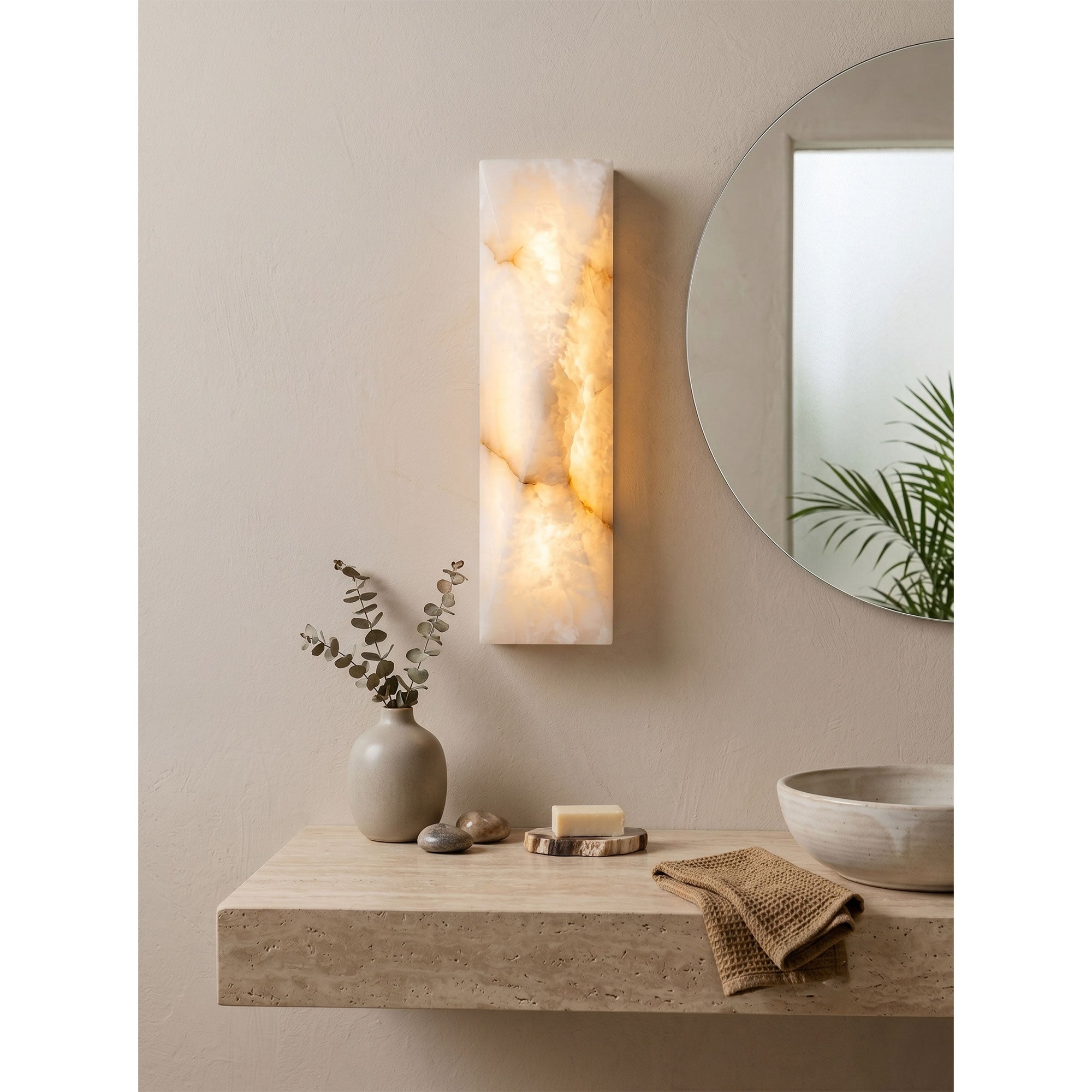 Close-up of the top of the illuminated alabaster sconce.