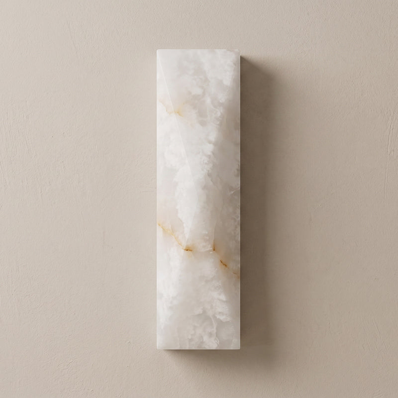 The Tropez Alabaster Wall Sconce unlit, showcasing its material texture.