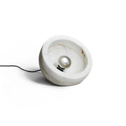 Tsuki Table Lamp in white marble with a polished chrome bulb.