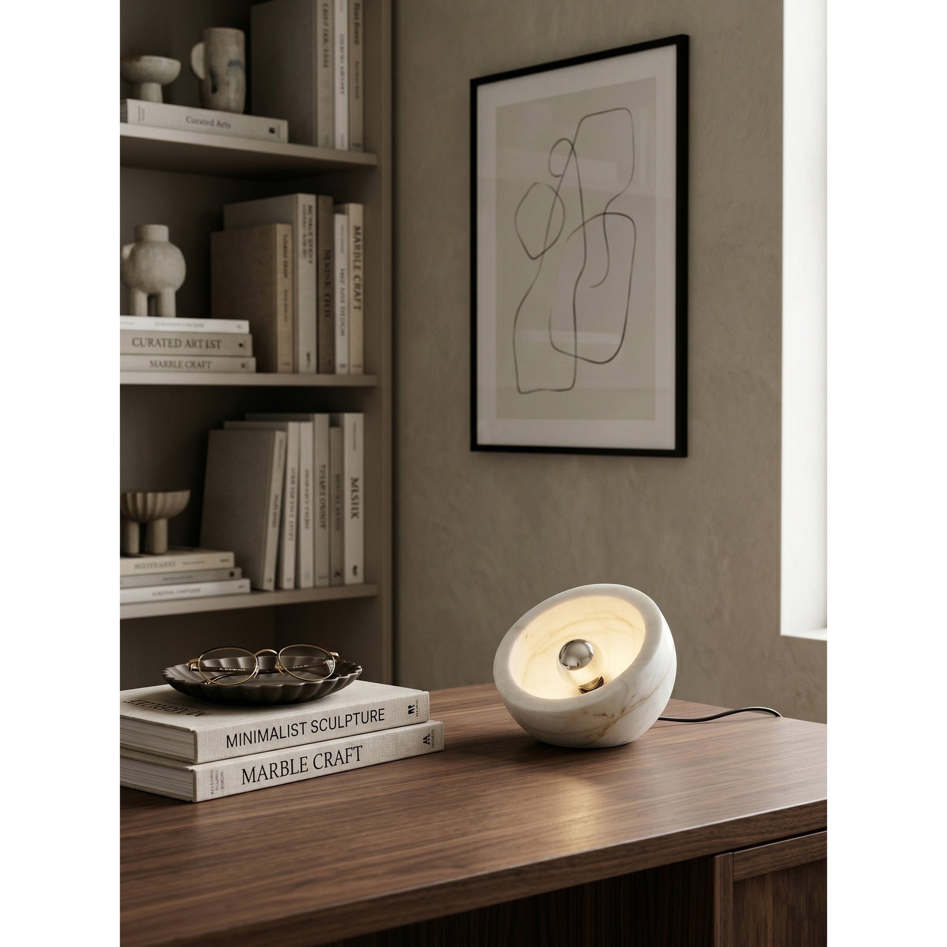 Tsuki Table Lamp styled on a modern living room shelf.