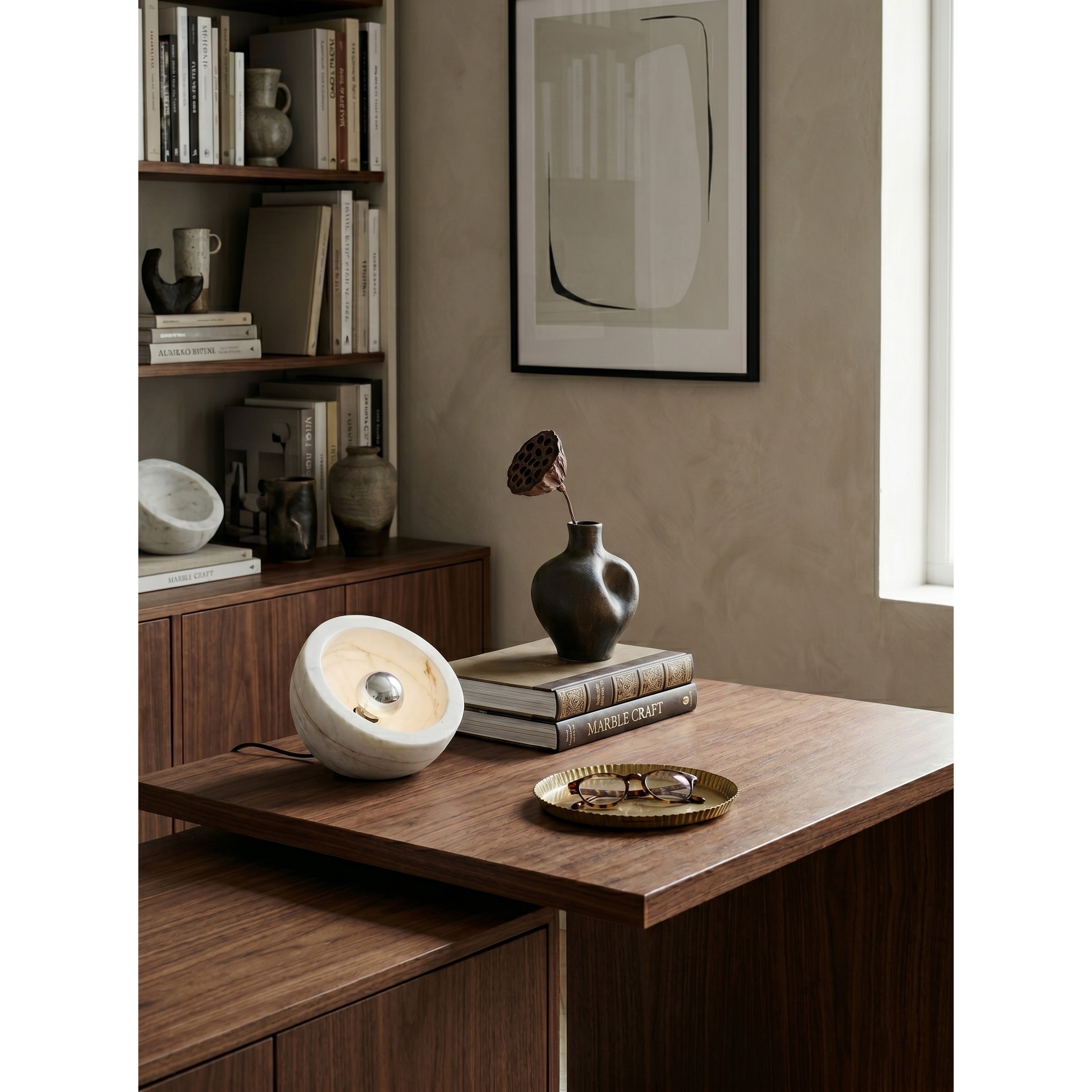 Tsuki Table Lamp placed on a minimalist bedside table.