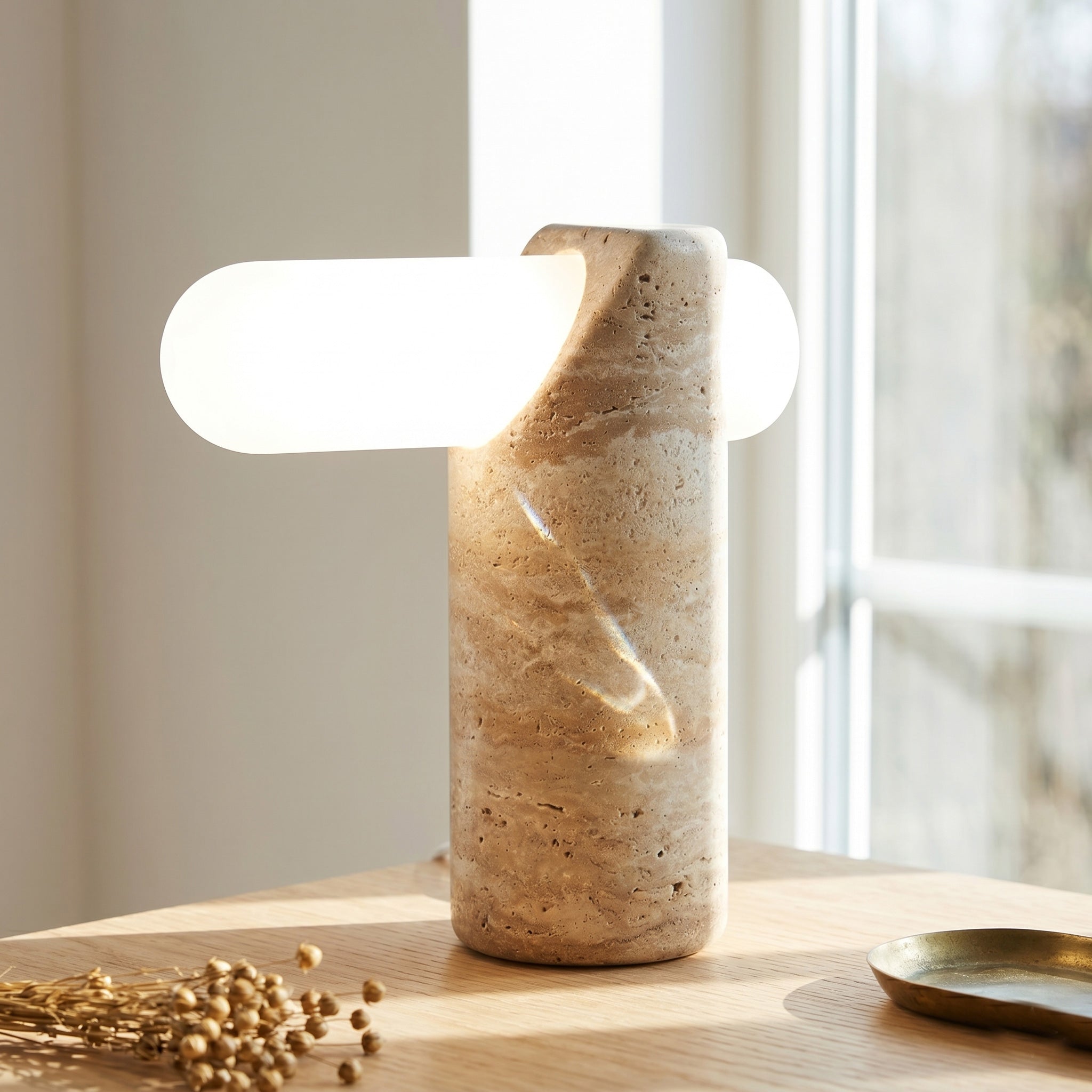 The table lamp shown illuminated, casting a warm, ethereal glow.