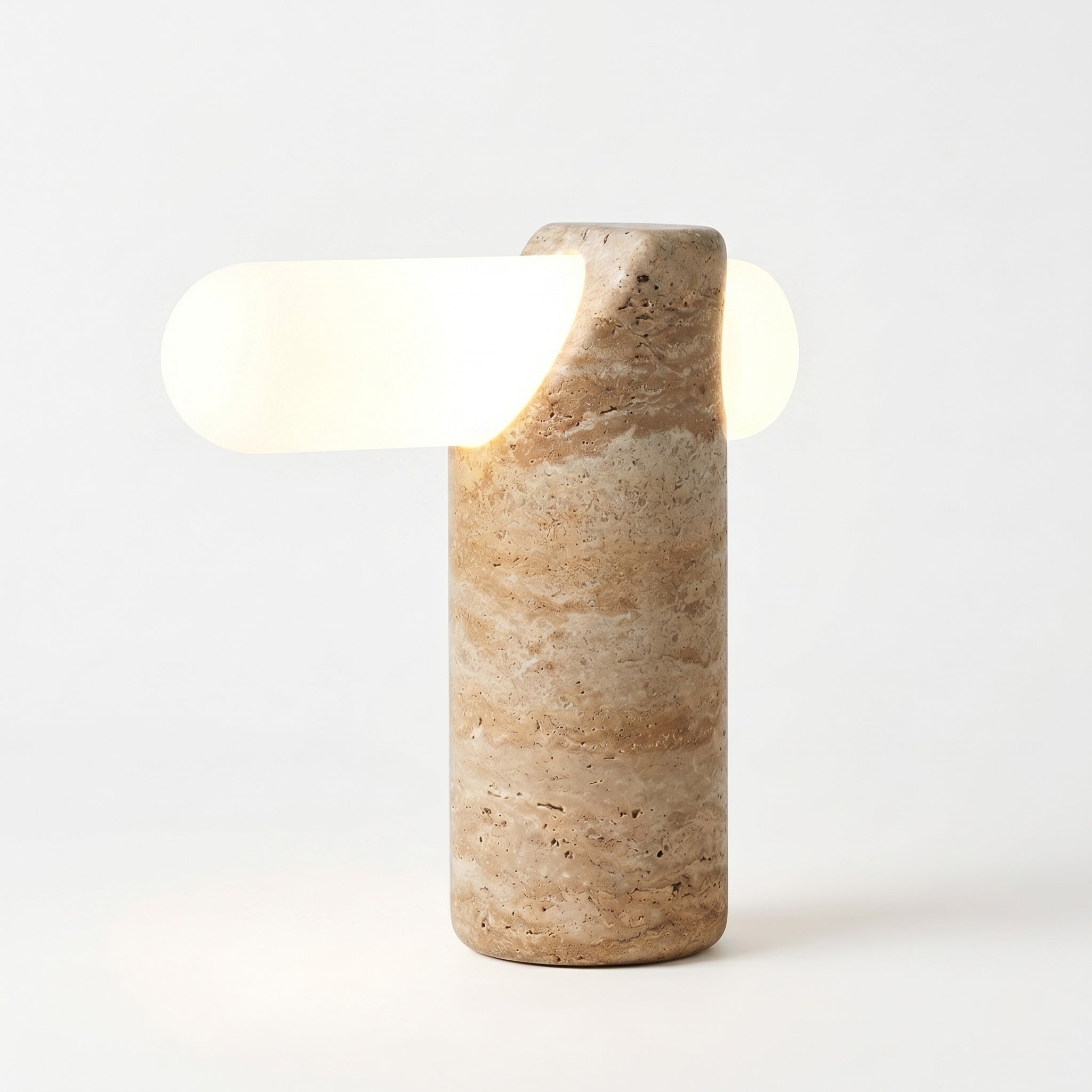 A close-up shot contrasting the lamp's raw stone texture with a smooth surface.
