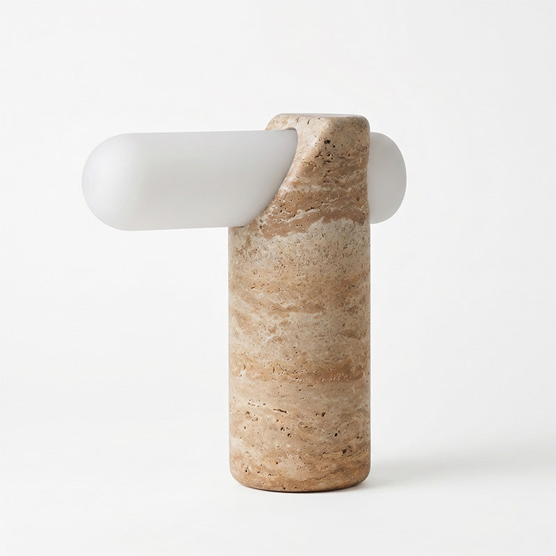 The VIA Travertine Table Lamp shown unlit in a brightly lit room.