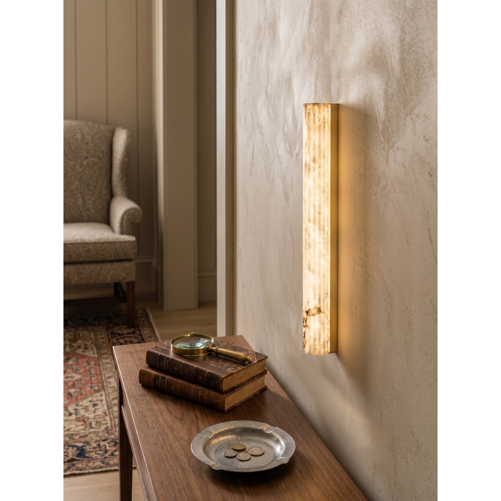 The 90cm version of the vertical alabaster wall sconce making a statement.