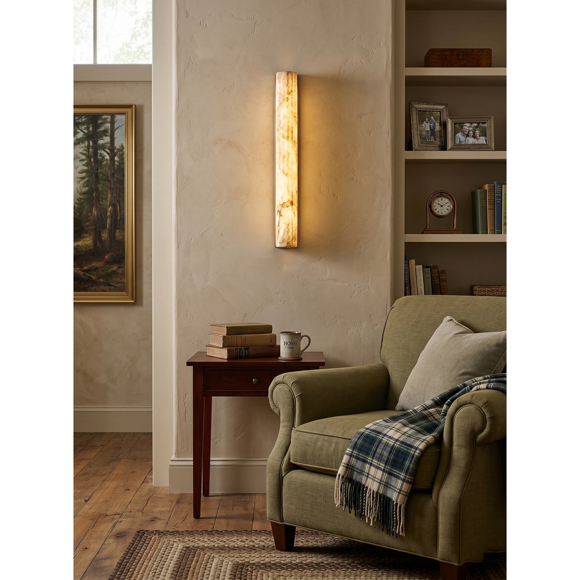 The alabaster sconce used as a horizontal picture light above a piece of art.