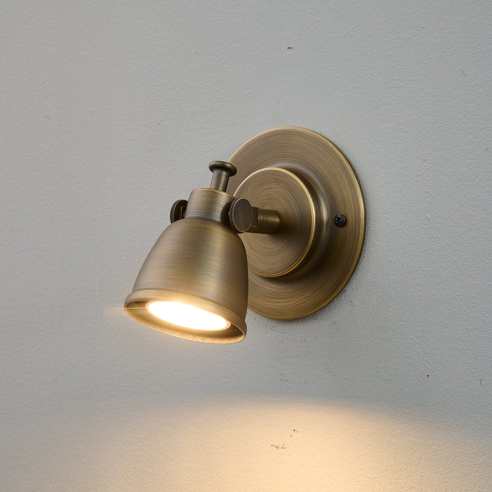 Lifestyle image of the sconce in an urban loft setting.