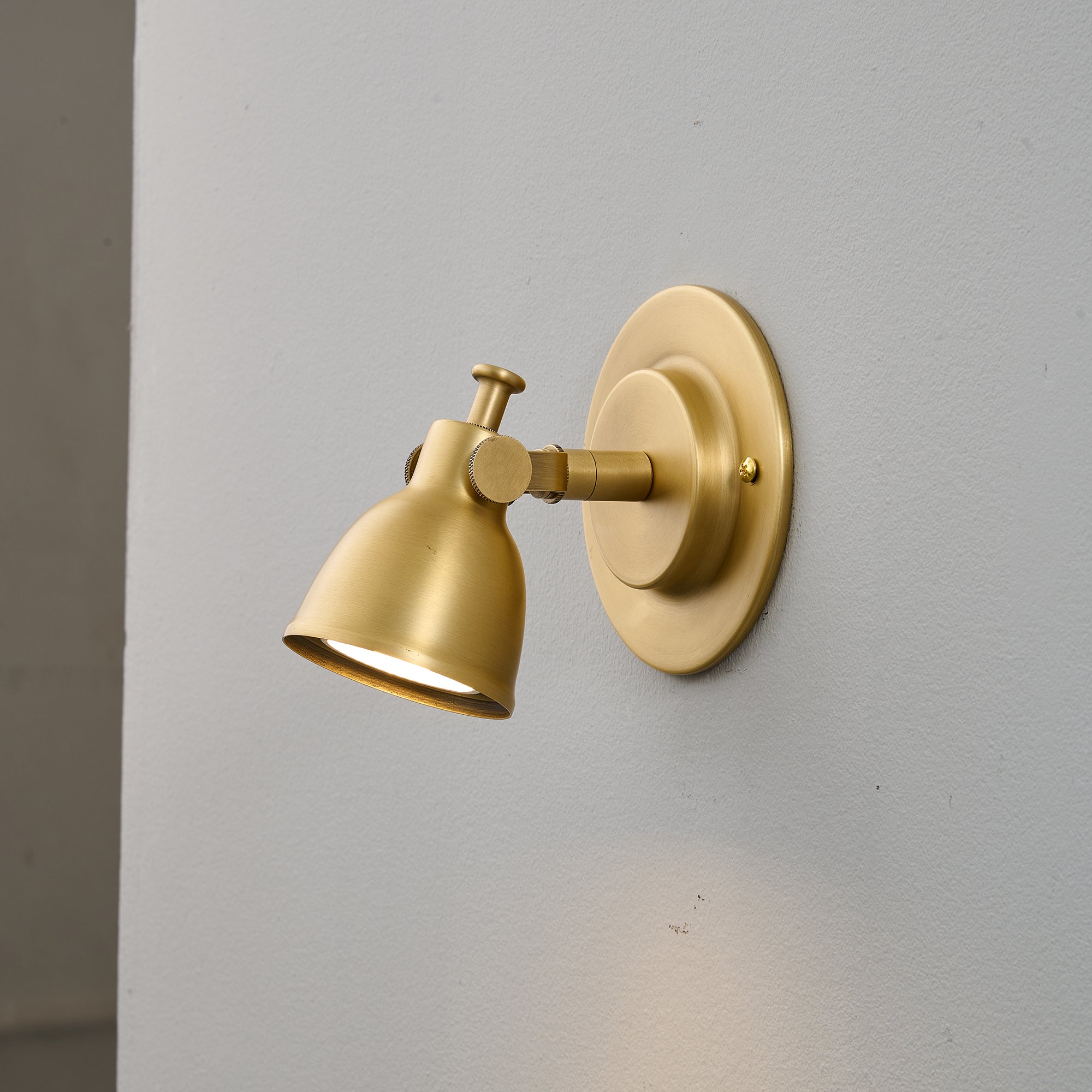 Waldo Wall Sconce shown in a transitional hallway.