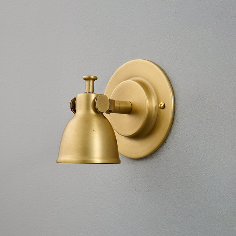 The sconce angled to provide ambient upward lighting.