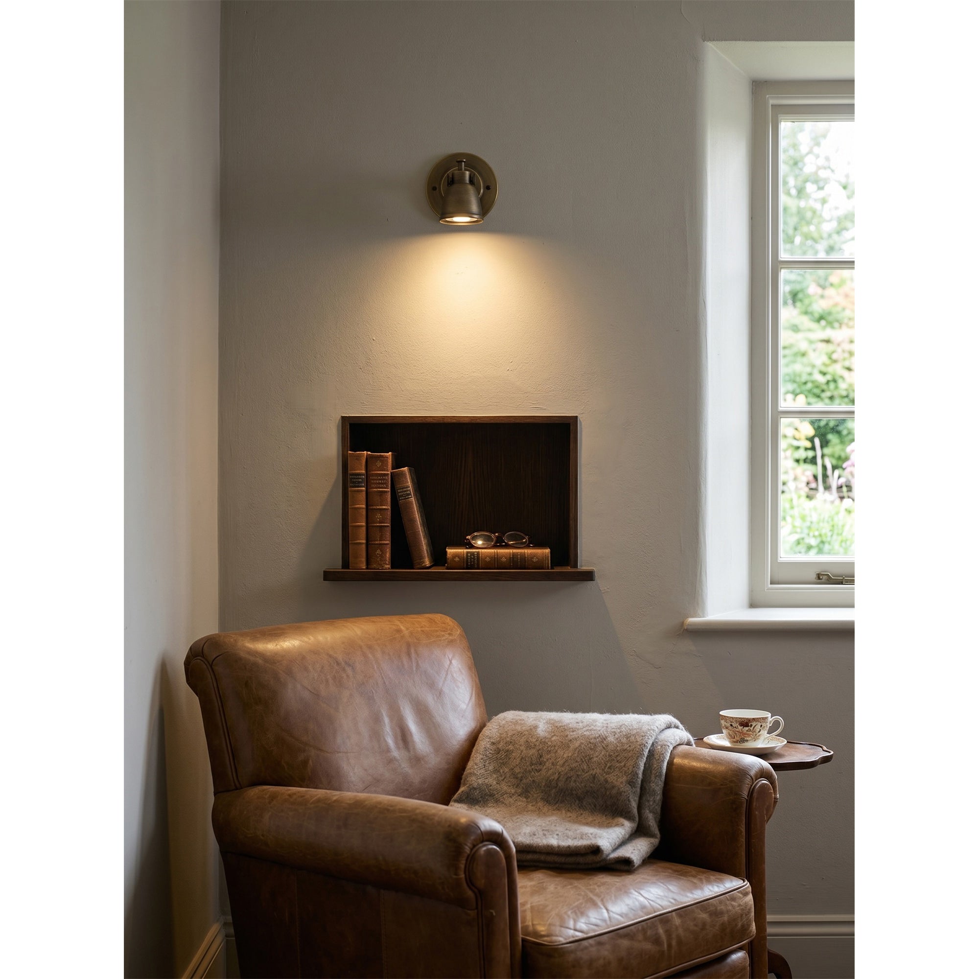 A pair of Waldo Wall Sconces flanking a modern bathroom mirror.
