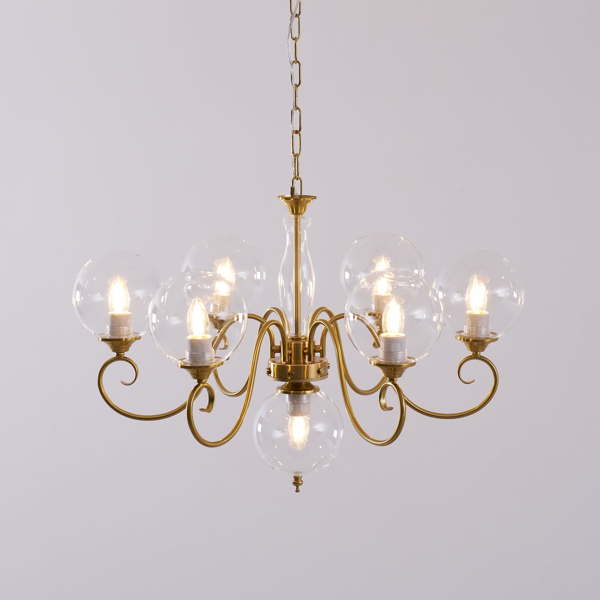 The antique brass finish complementing wooden furniture.