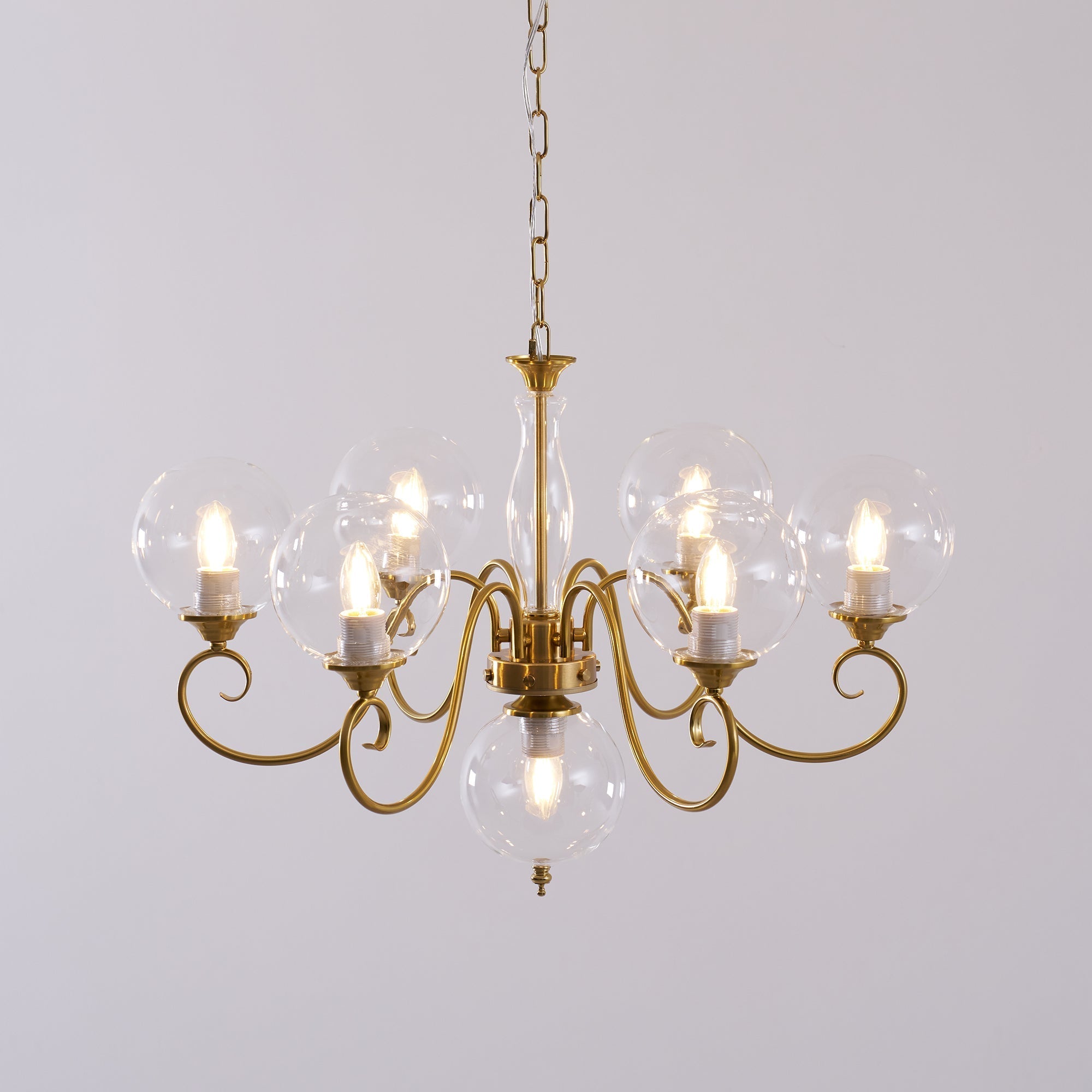 The antique brass finish complementing wooden furniture.