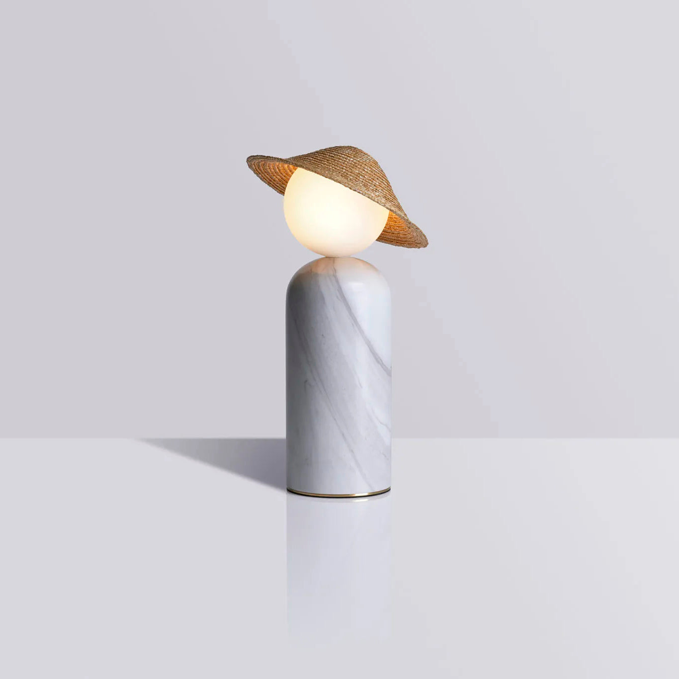 The Theros Table Lamp on an entry console table, adding a welcoming ambiance.